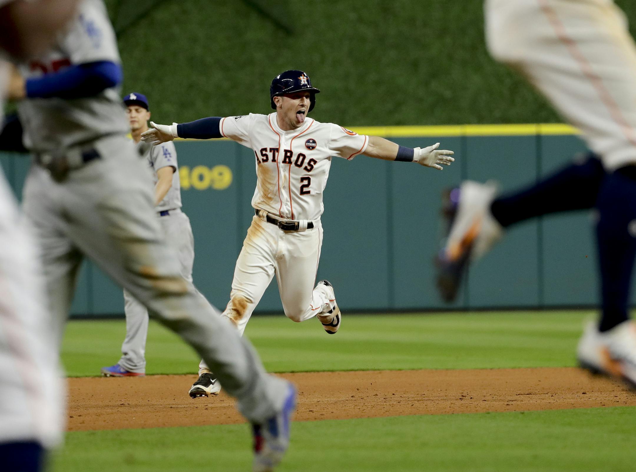 Houston Astros' Alex Bregman celebrates after hitting the game winning single during Game 5 of baseball's World Series against the Los Angeles Dodgers Monday, Oct. 30, 2017, in Houston. (AP Photo/Matt Slocum)