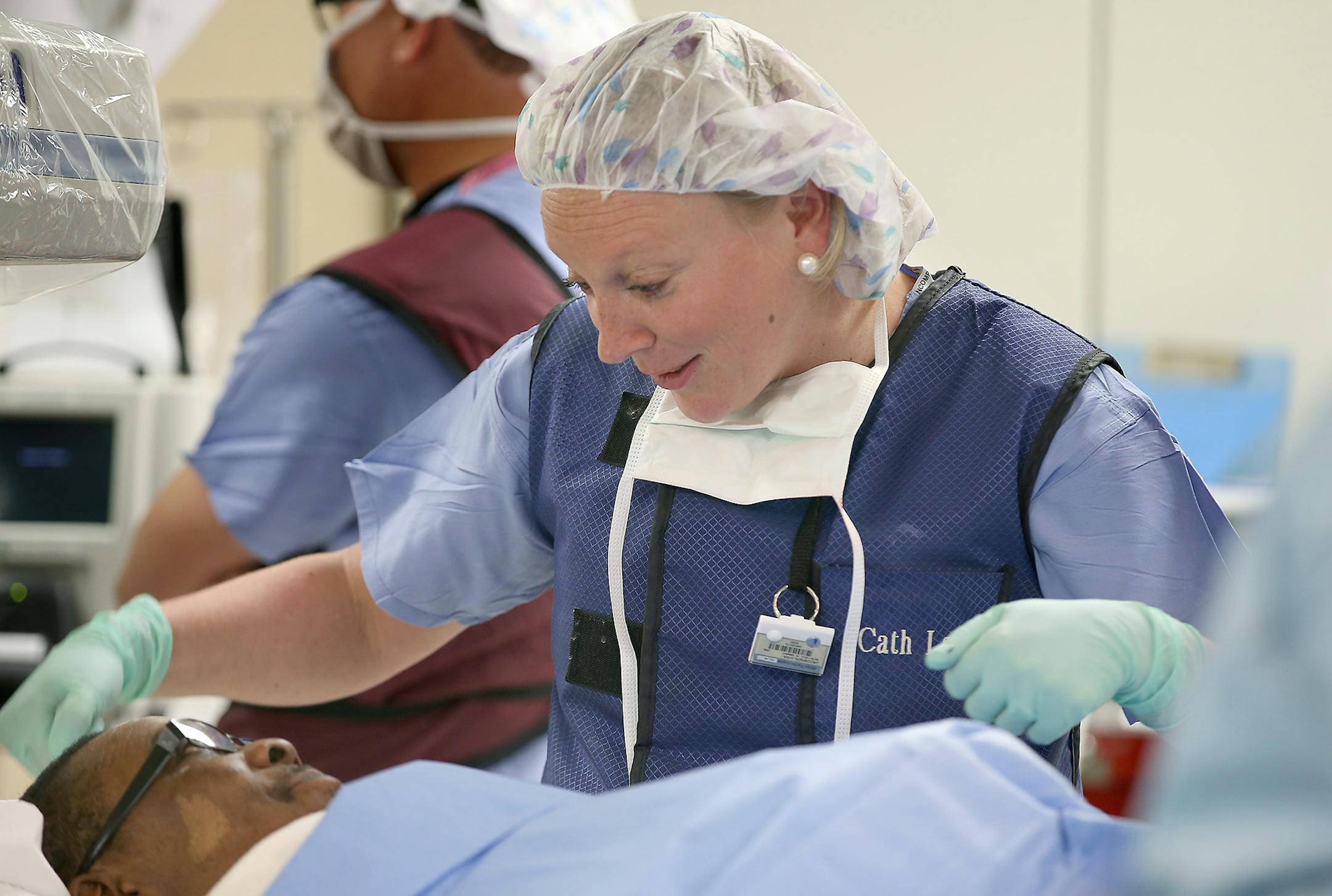 Gina Jacobsen, RN, checked on patient Joe Jones after Fouad Bachour, MD, and his team implanted a CardioMem, a new St. Jude product, into him at Hennepin County Medical Center, Thursday, February 26, 2015 in Minneapolis, MN. ] (ELIZABETH FLORES/STAR TRIBUNE) ELIZABETH FLORES • eflores@startribune.com