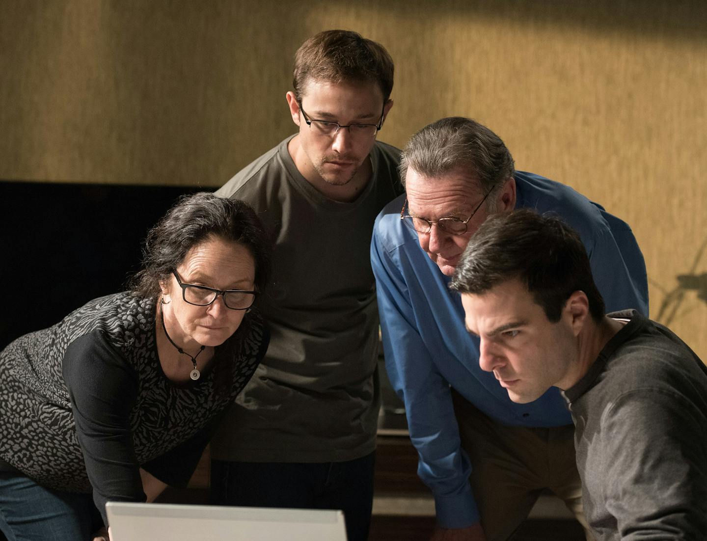 This image released by Open Road Films shows, from left, Melissa Leo as Laura Poitras, Joseph Gordon-Levitt as Edward Snowden, Tom Wilkinson as Ewen MacAskill and Zachary Quinto as Glenn Greenwald in a scene from, "Snowden." (J&#xb8;rgen Olczyk/Open Road Films via AP) ORG XMIT: MIN2016091513434018