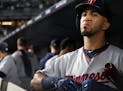 Minnesota Twins left fielder Eddie Rosario looks to the scoreboard in the dugout after losing to the New York Yankees, 8-4, the American League Wild C