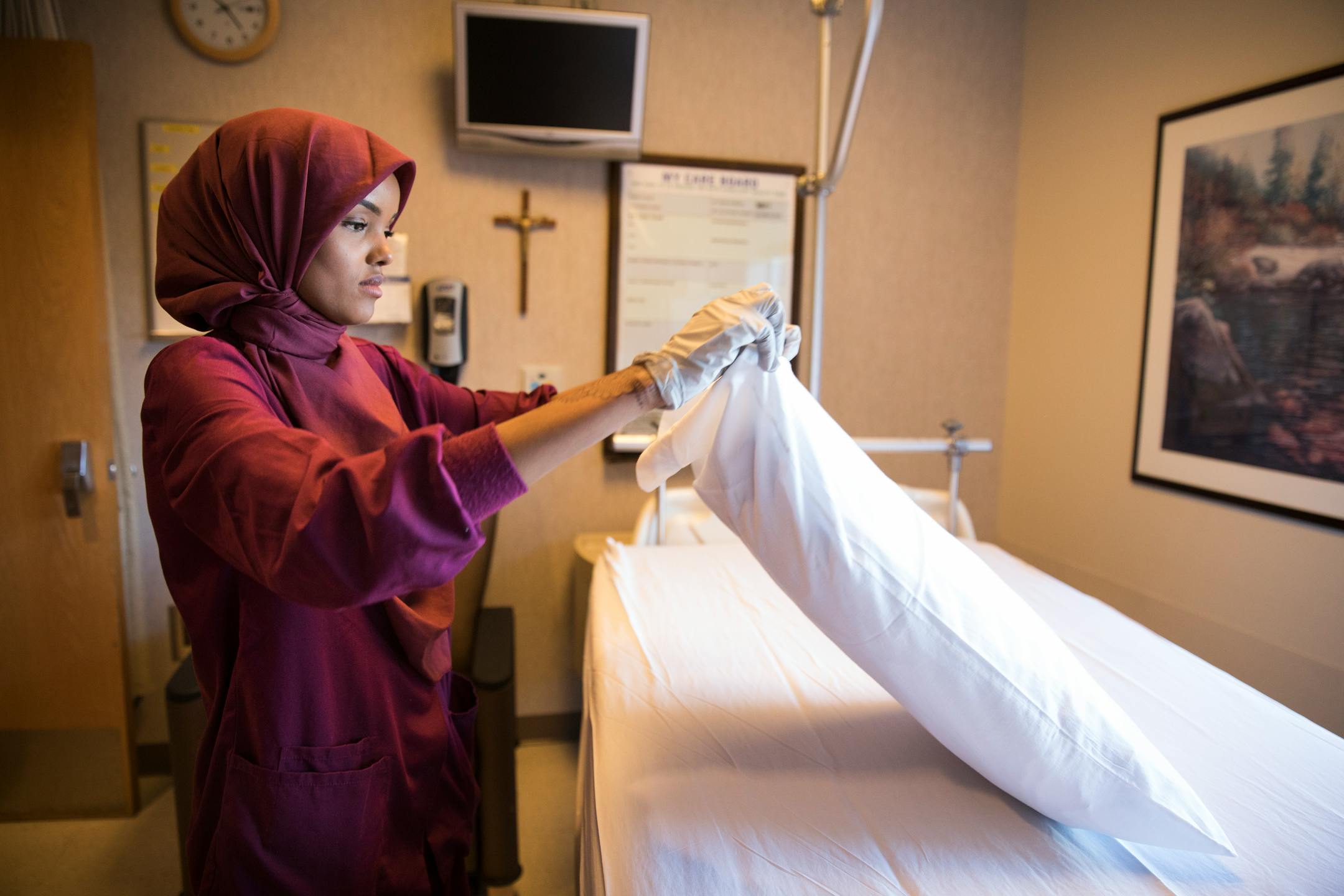 Halima Aden cleans a hospital room at St. Cloud Hospital.