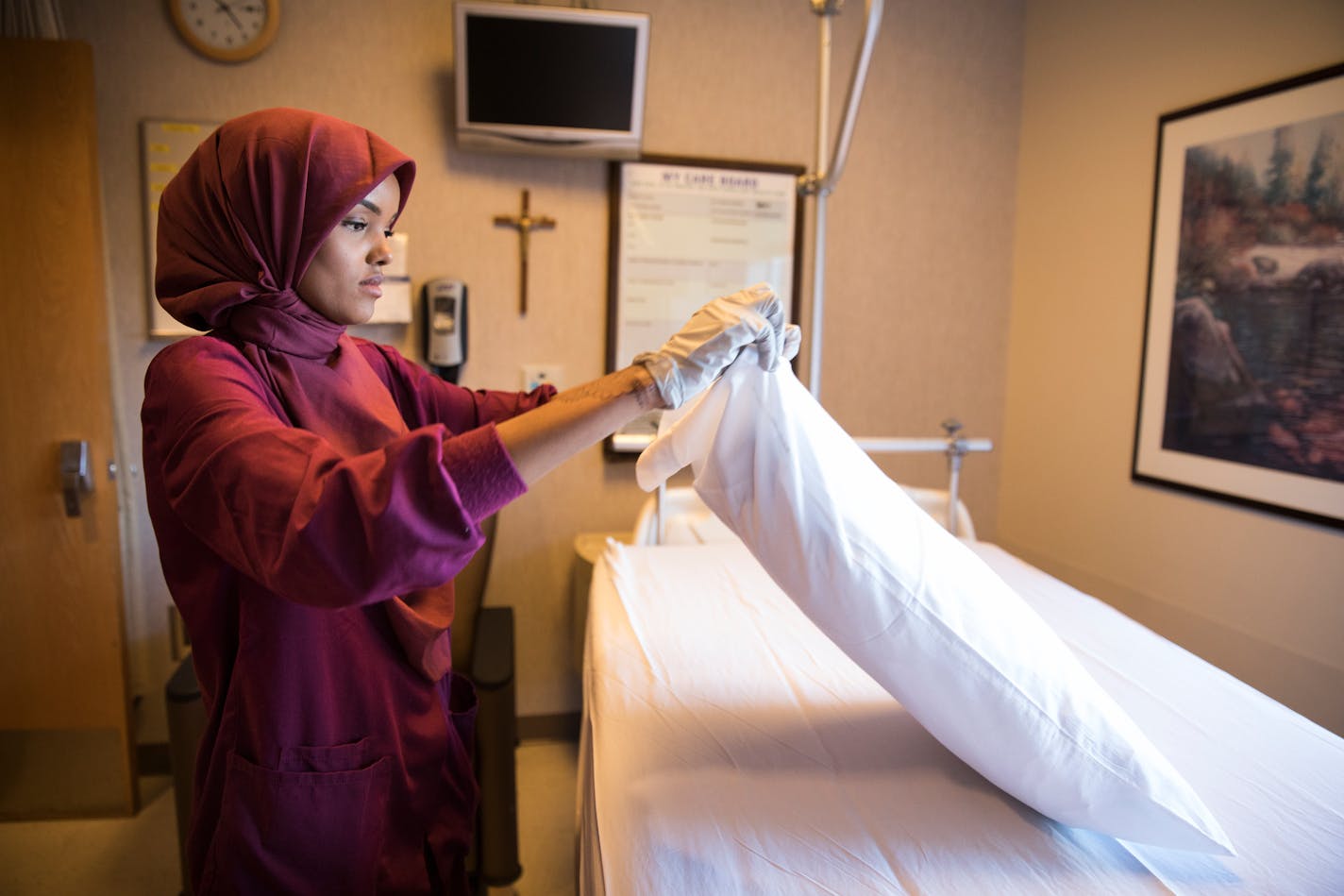 Halima Aden cleans a hospital room at St. Cloud Hospital.