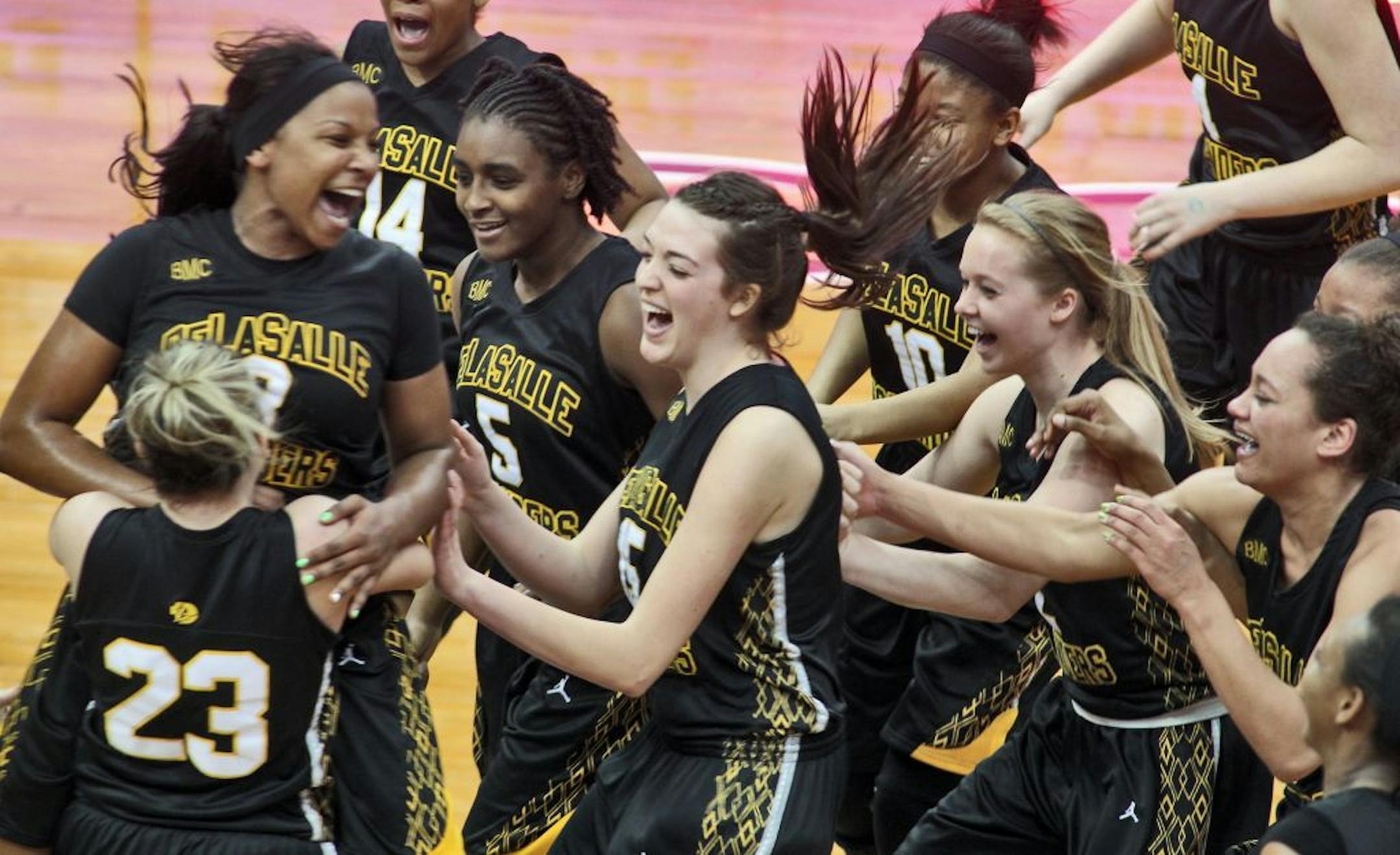 Class 3A Girls Prep Basketball - DeLaSalle vs. Richfield.. DeLaSalle won 65-45. DeLaSalle players celebrated their victory at the end of the game.