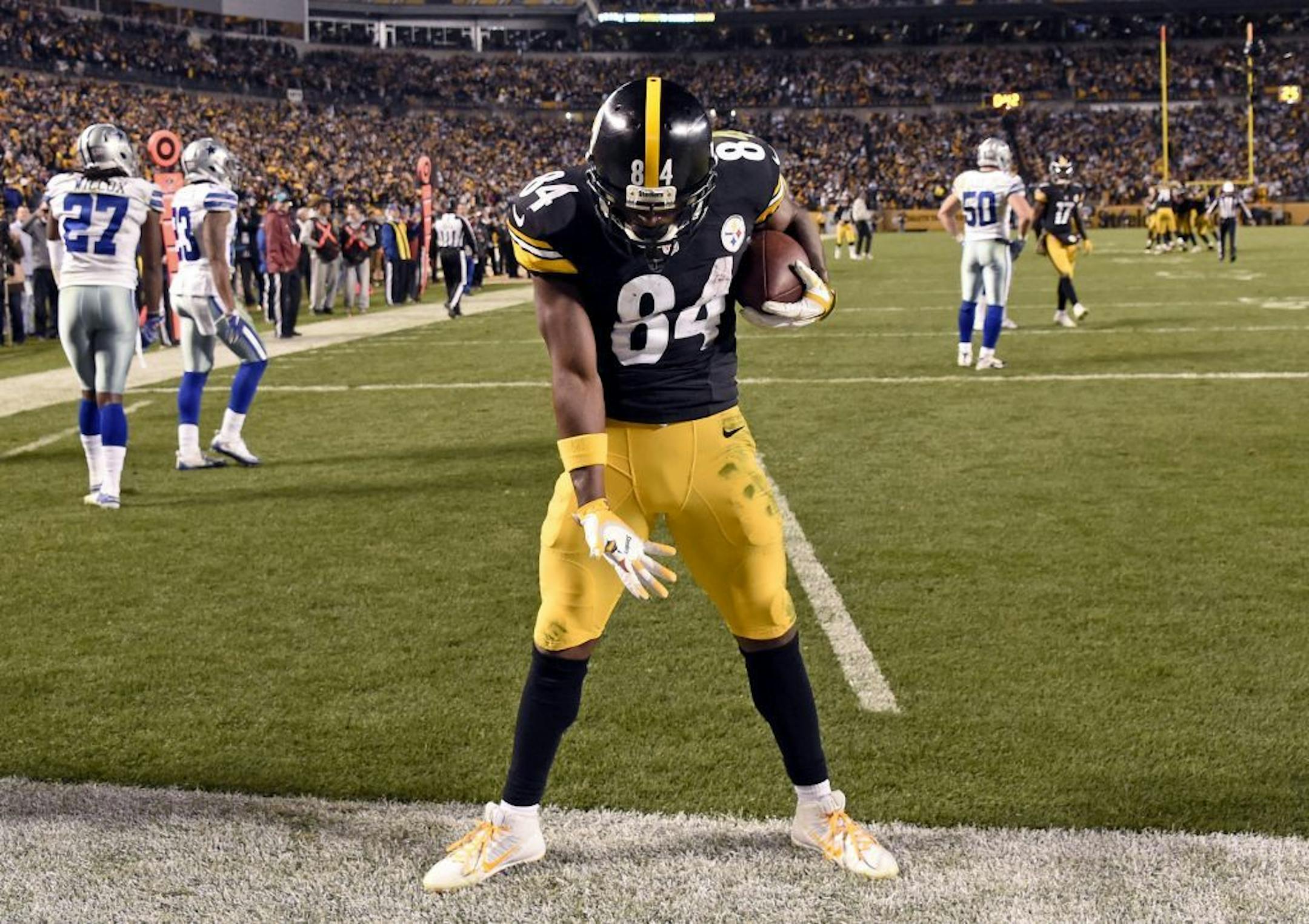FILE - In this Nov. 13, 2016, file photo, Pittsburgh Steelers wide receiver Antonio Brown (84) celebrates scoring a touchdown during an NFL football game against the Dallas Cowboys in Pittsburgh. Freed by NFL officials to let loose in the end zone, Brown hopes to strut his stuff in Sunday's opener in Cleveland.