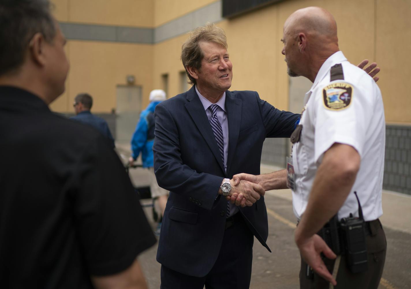 U.S. Senate candidate Jason Lewis greeted Freeborn County Sheriff Kurt Freitag before the start of his news conference Monday afternoon. ] JEFF WHEELER • Jeff.Wheeler@startribune.com U.S. Senate candidate Jason Lewis held a "Law Enforcement for Lewis" press conference outside the former Third Precinct Police Headquarters in Minneapolis Monday afternoon, June 22, 2020. Lewis was joined by some law enforcement officers, active and retired.