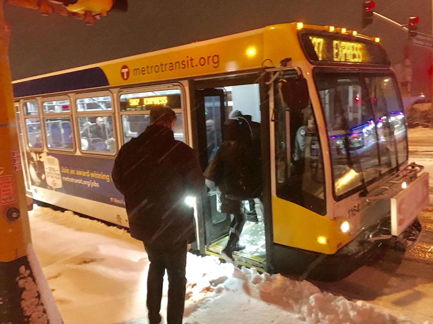 The express bus stop on Vernon Avenue in Edina was busier than usual before dawn Wednesday as the snow flew.