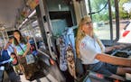 Diane Rude drove her Metro Transit bus along route 14E Friday morning, often greeting passenters with a smile and a wave. The Woodbury resident was as