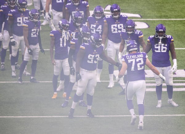 Vikings rookie offensive lineman Ezra Cleveland (72) ran on the field during team introductions against Atlanta on Sunday. Cleveland started his first