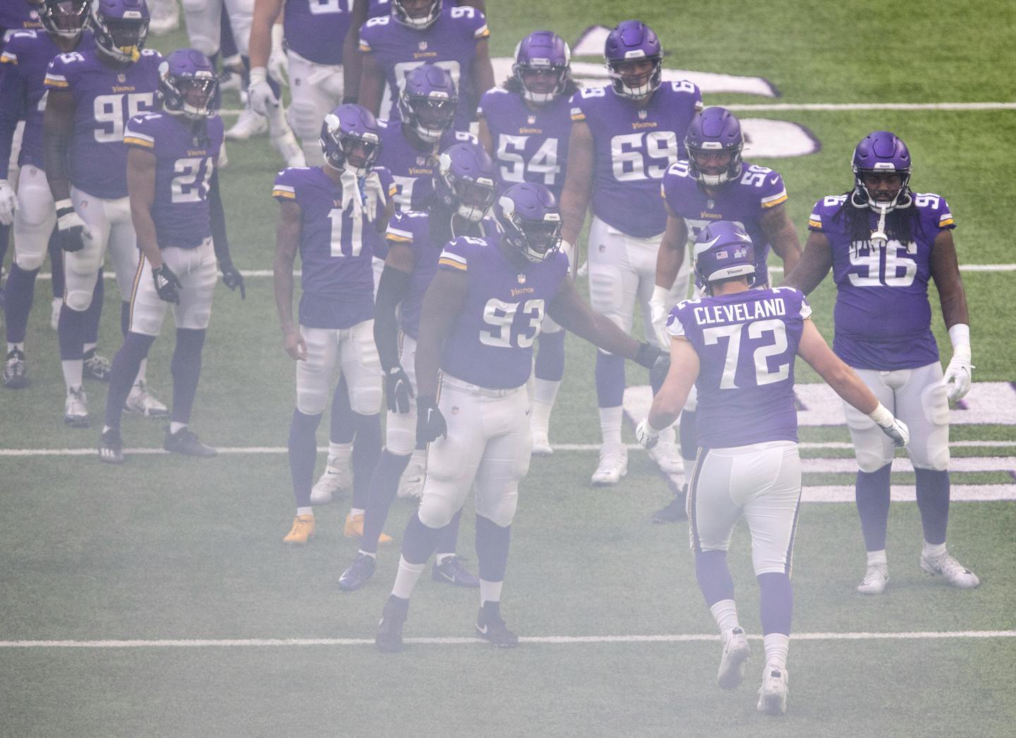 Vikings rookie offensive lineman Ezra Cleveland (72) ran on the field during team introductions against Atlanta on Sunday. Cleveland started his first NFL game -- but at right guard, not at left tackle, the position he is eventually expected to play.