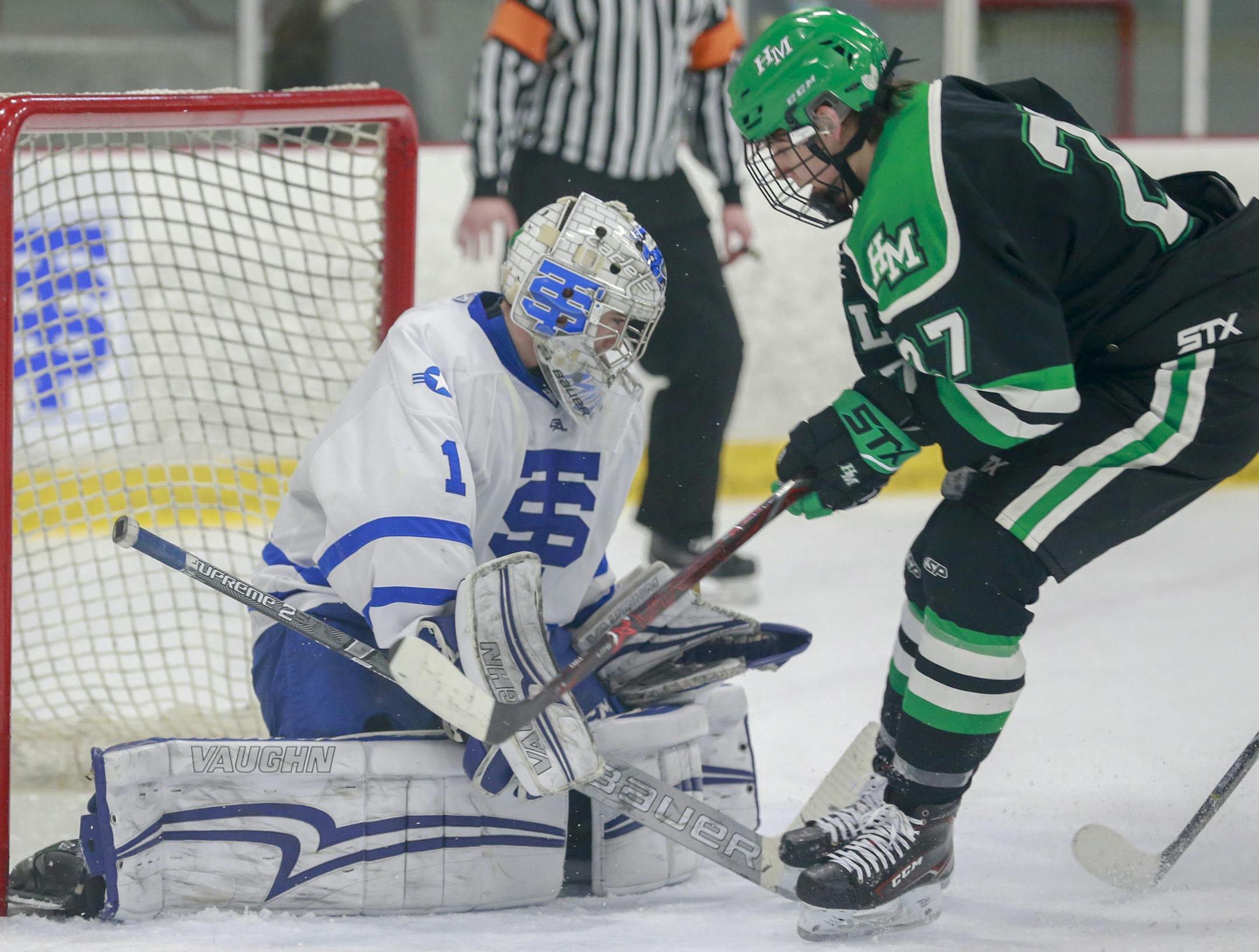 St. Thomas Academy goalie Muzzy Donohue (1) stopped a shot by Hill-Murray's Charlie Strobel (27). High School Boys Hockey
Hill-Murray Pioneers @ St. Thomas Academy Cadets St. Thomas Academy Arena January 31, 2019. Photo by Jeff Lawler, SportsEngine
