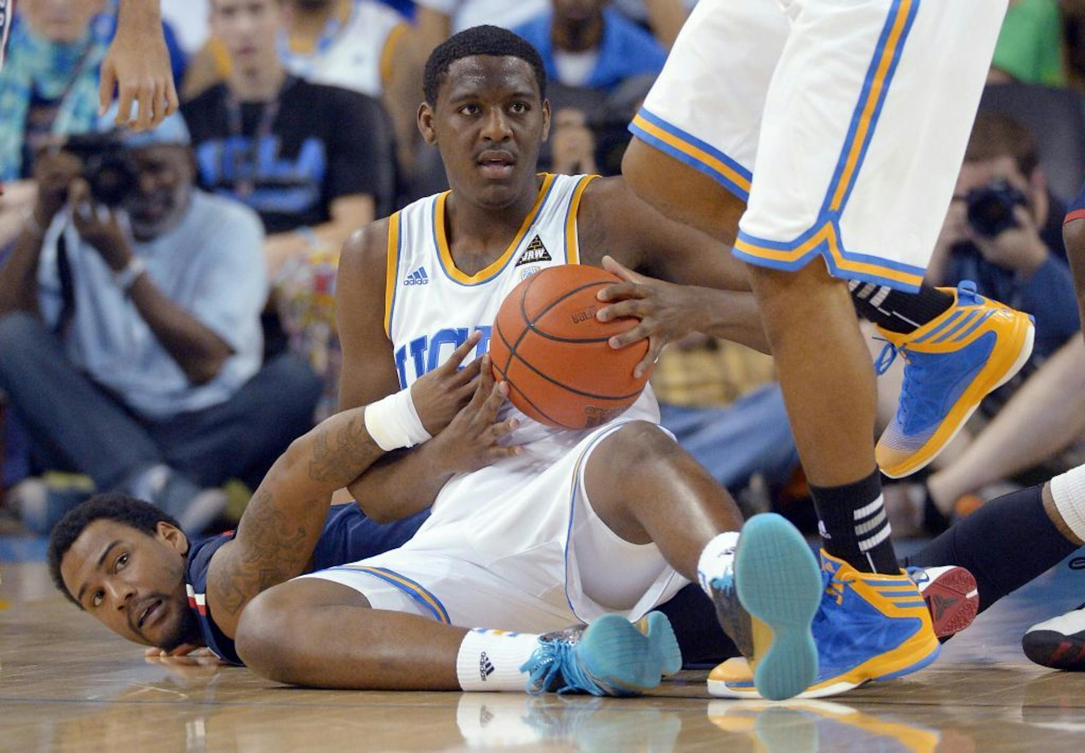 Arizona guard Jordin Mayes, left, and UCLA guard Jordan Adams.
