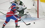 Montreal Canadiens' Artturi Lehkonen scores against Minnesota Wild's goaltender Devan Dubnyk during second-period NHL hockey game action in Montreal, 