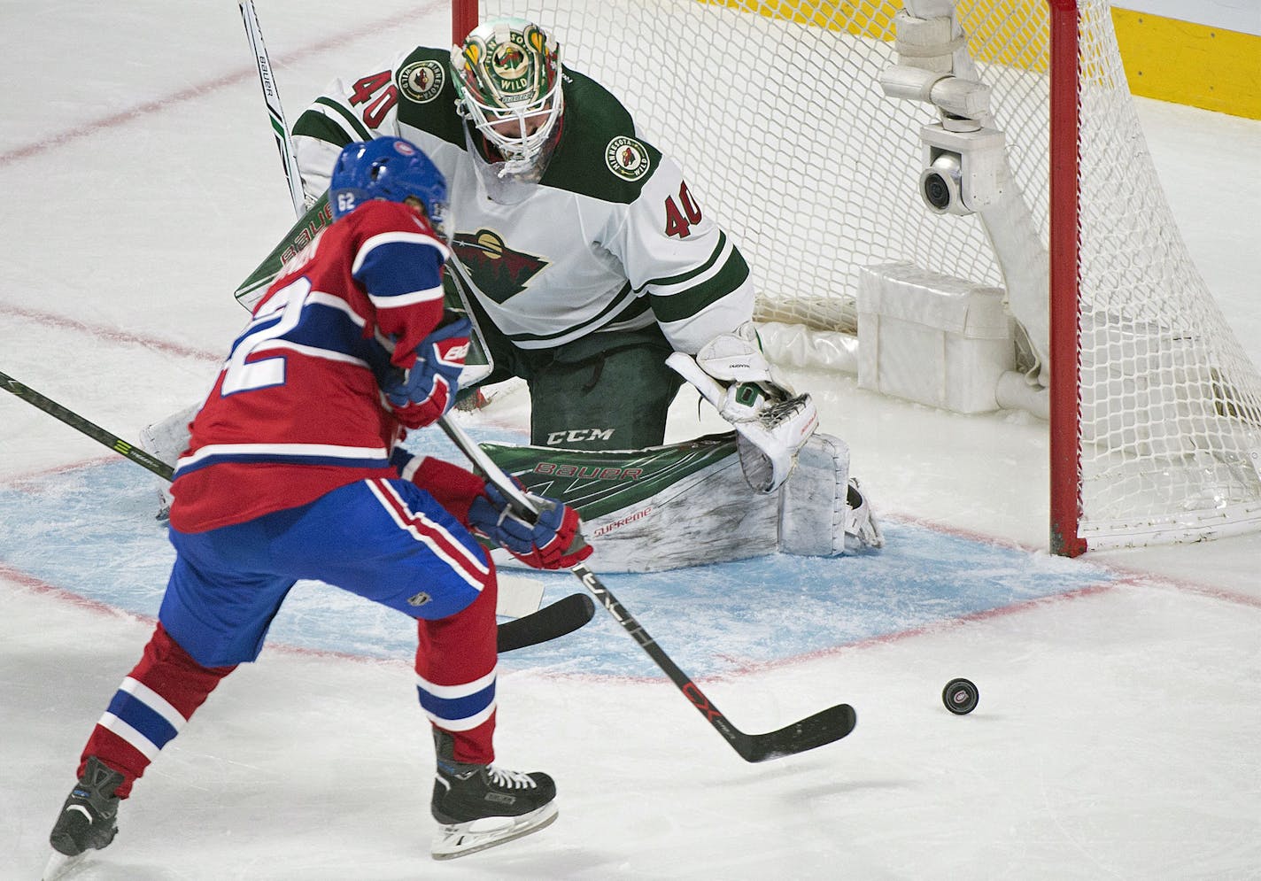 Montreal Canadiens' Artturi Lehkonen scores against Minnesota Wild's goaltender Devan Dubnyk during second-period NHL hockey game action in Montreal, Thursday, Dec. 22, 2016. (Graham Hughes/The Canadian Press via AP)