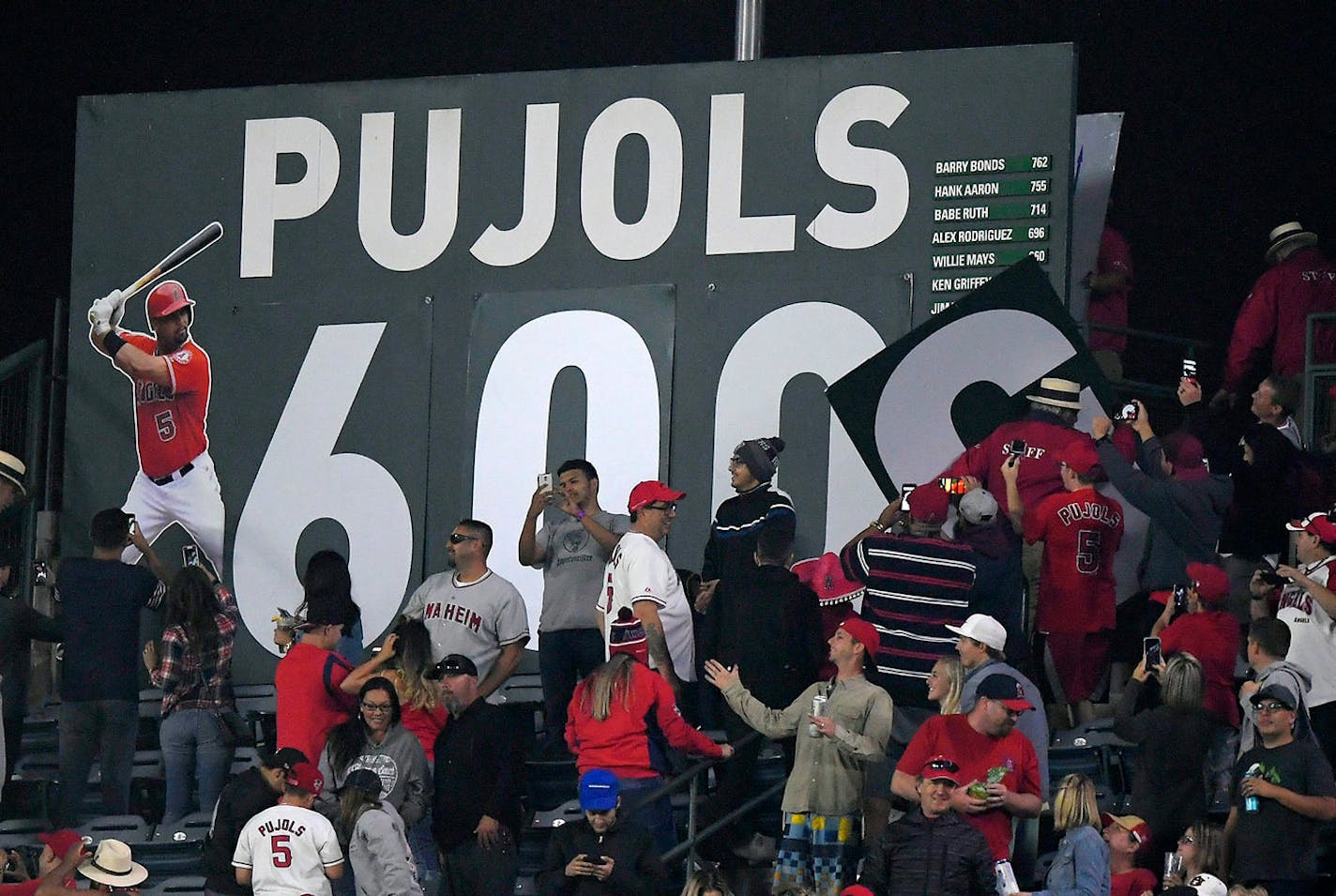 CORRECTS TO GRAND SLAM - A sign in center field for Los Angeles Angels' Albert Pujols is changed to "600" after Pujols hit a grand slam, his 600th homer, during the fourth inning of a baseball game against the Minnesota Twins, Saturday, June 3, 2017, in Anaheim, Calif.