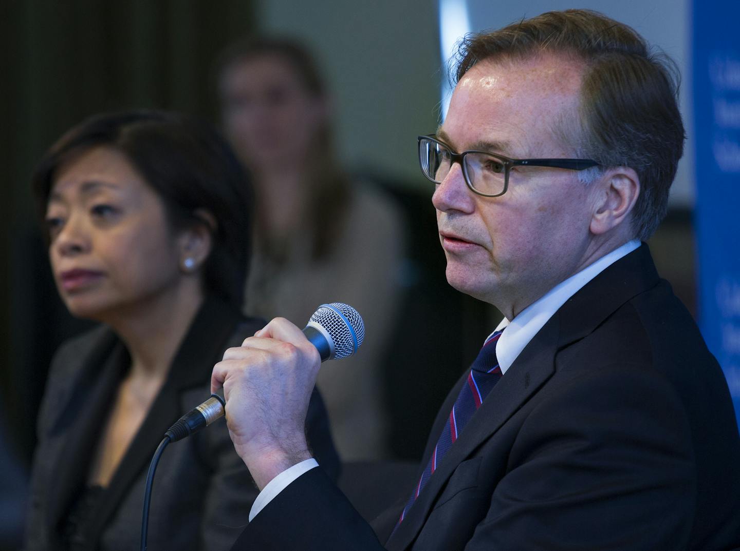 Columbia Journalism School Dean Steve Coll answers a question during a news conference to discuss findings of a report conducted at the Columbia School of Journalism surrounding Rolling Stone magazine's expose of what it called a culture of sex assaults at the University of Virginia, Monday, April 6, 2015, in New York. Rolling Stone has officially retracted the story. Columbia Journalism School Academic Dean Sheila Coronel listens at left. (AP Photo/Craig Ruttle)