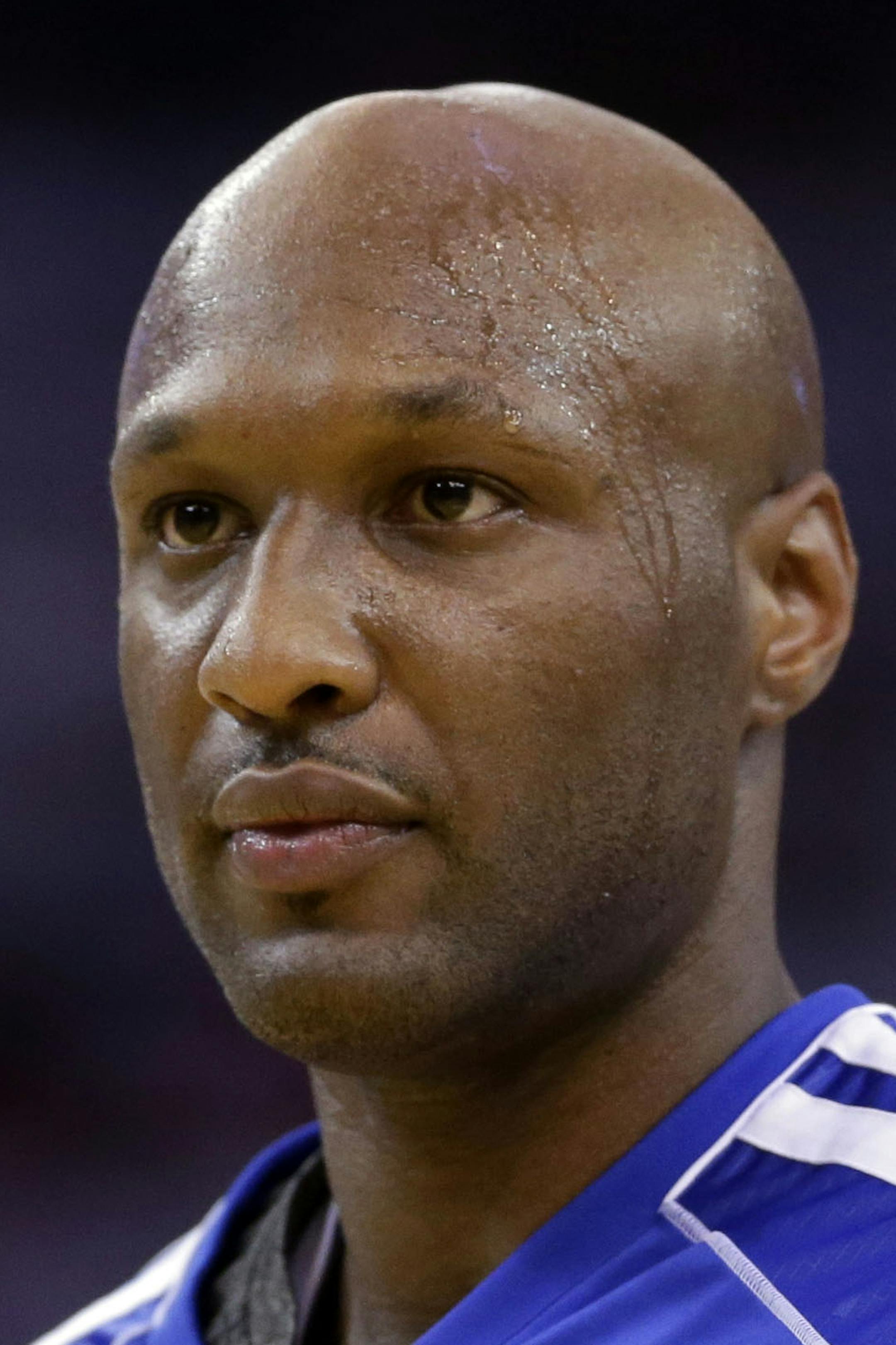 FILE - This Jan. 2, 2013 file photo shows Los Angeles Clippers' Lamar Odom (7) in action against the Golden State Warriors during an NBA basketball game in Oakland, Calif. Authorities say former NBA and reality TV star Odom has been hospitalized after he was found unconscious at a Nevada brothel. Nye County Sheriff Sharon A. Wehrly says the department got a call Tuesday afternoon, Oct. 13, 2015, requesting an ambulance for an unresponsive man at the Love Ranch in Crystal, Nevada about 70 miles o