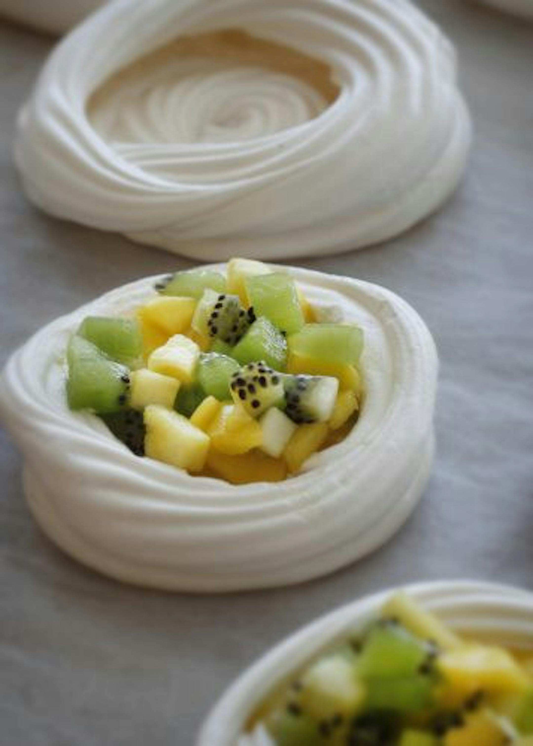 Fill each nest with a dollop of lemon curd and a selection of colorful fruit.