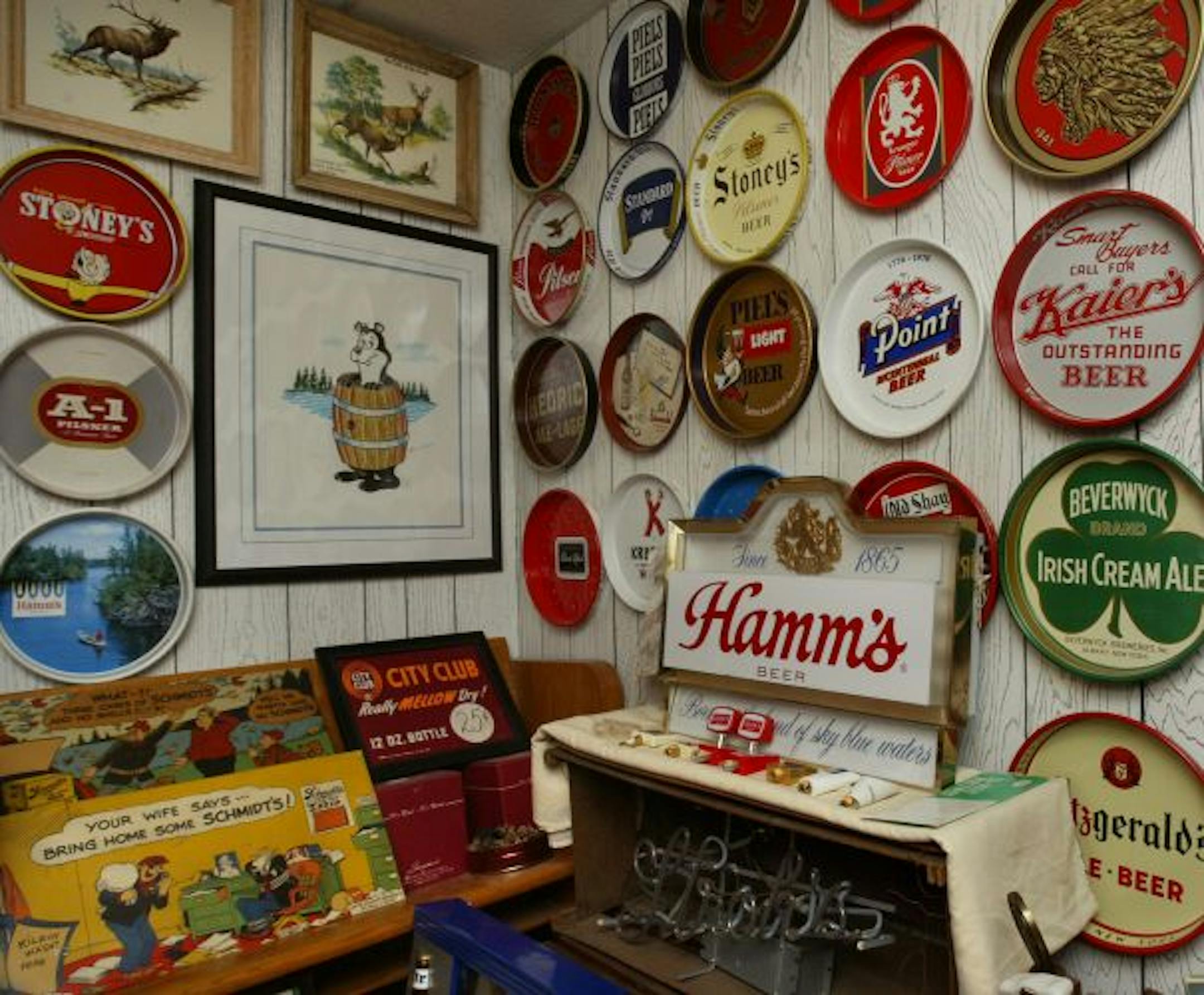 Jim and Ruth Beaton's display includes tin signs and framed pictures from breweries around Minnesota.