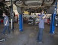 Car mechanics Zach Stuen, right, and John Buttner, left, worked on cars at Lift Garage, Friday, July 24, 2020 in Minneapolis, MN. The Minneapolis nonp