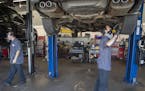 Car mechanics Zach Stuen, right, and John Buttner, left, worked on cars at Lift Garage, Friday, July 24, 2020 in Minneapolis, MN. The Minneapolis nonp