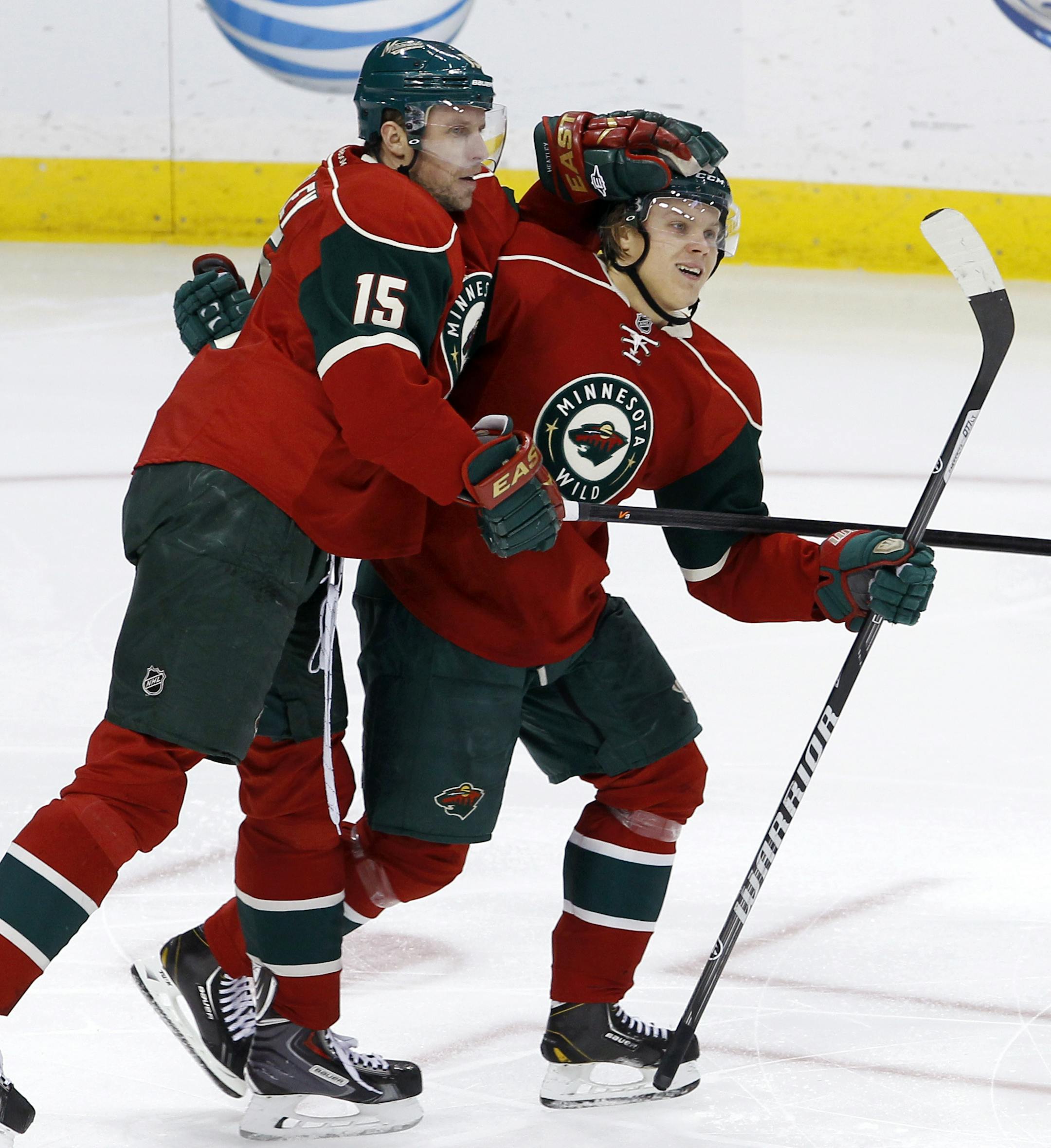 Wild right winger Dany Heatley (15) and center Mikael Granlund celebrated Heatley's goal in Minnesota's 4-0 victory over New Jersey on Sunday. The goal was Heatley's second of the season. His first was an empty-net tally.