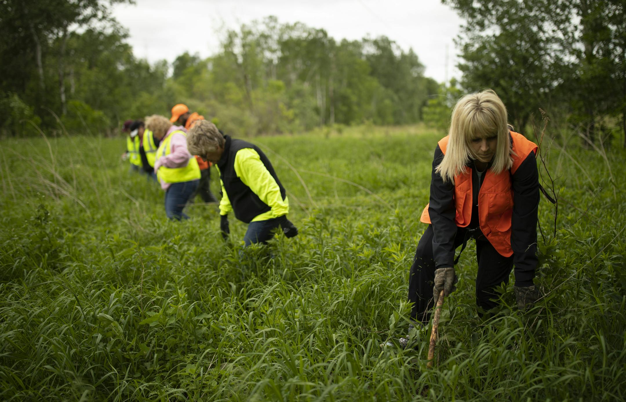 Kelly Madsen, foreground, looked with other United Legacy volunteers for any trace of David Dahl in Ramsey Sunday morning. ] JEFF WHEELER ï jeff.wheeler@startribune.com The all-volunteer nonprofit United Legacy picks up missing person searches with ATVs, horses and specialized equipment to continue ground searches when public safety organizations can no longer keep looking. Then they keep looking until families ask them to stop. Deanna Villella started the nonprofit three years ago, followi