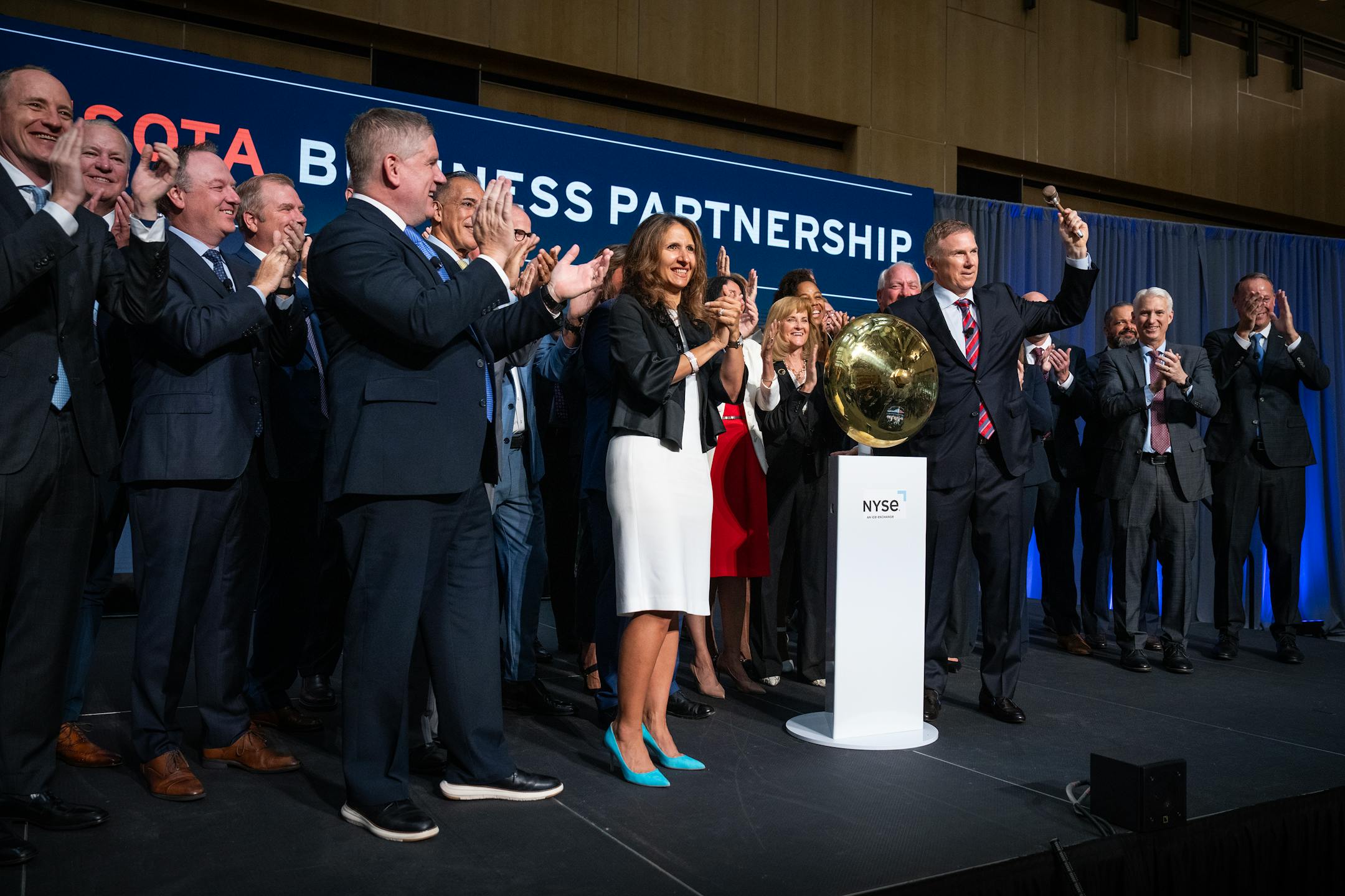 Geoff Martha, chairman and CEO of Medtronic, rings the opening bell for the New York Stock Exchange on July 10