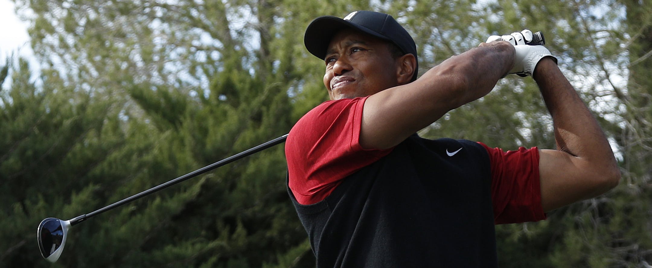 Tiger Woods hits off the second tee during a golf match against Phil Mickelson at Shadow Creek golf course, Friday, Nov. 23, 2018, in Las Vegas. (AP Photo/John Locher)