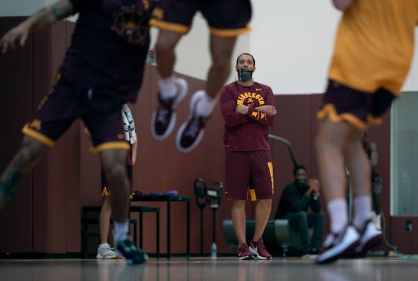 Gophers first year men’s basketball coach Ben Johnson watched his team practice in Athlete’s Village.