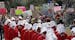 Members of the "Texas Handmaids" lead a women's march to the Texas State Capitol on the one-year anniversary of President Donald Trump's inauguration,