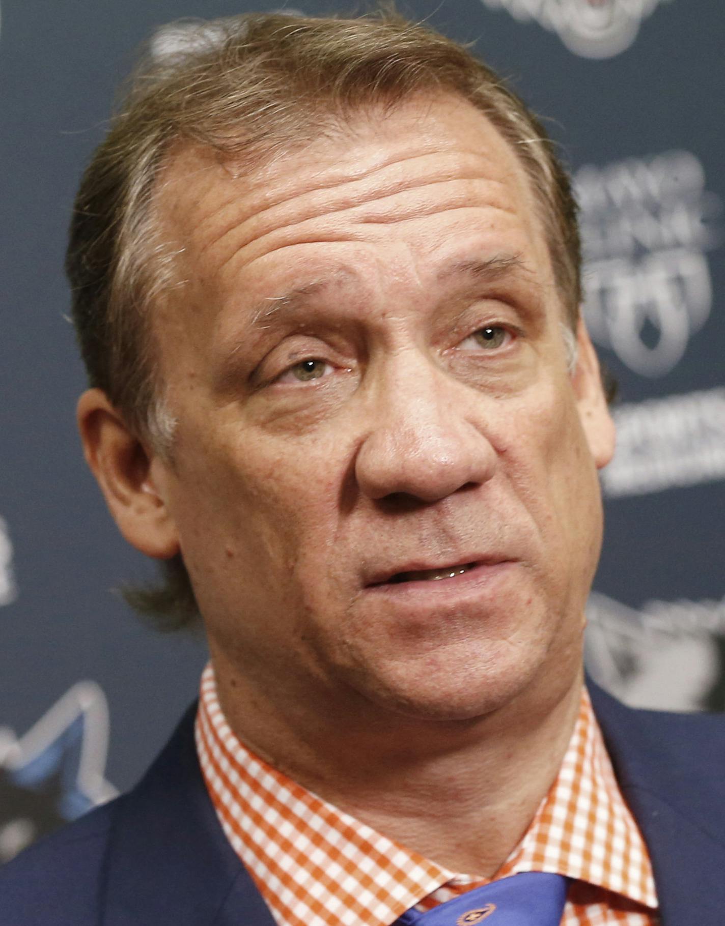 FILE - This is a June 25, 2015, file photo showing Minnesota Timberwolves president and coach Flip Saunders addressing the media during an NBA basketball news conference in Minneapolis. Saunders says he is being treated for cancer. Saunders announced Tuesday, Aug. 11, 2015, that he has been undergoing chemotherapy treatments for Hodgkin's lymphoma. He says his doctors are calling it "very treatable and curable." (AP Photo/Jim Mone, File)