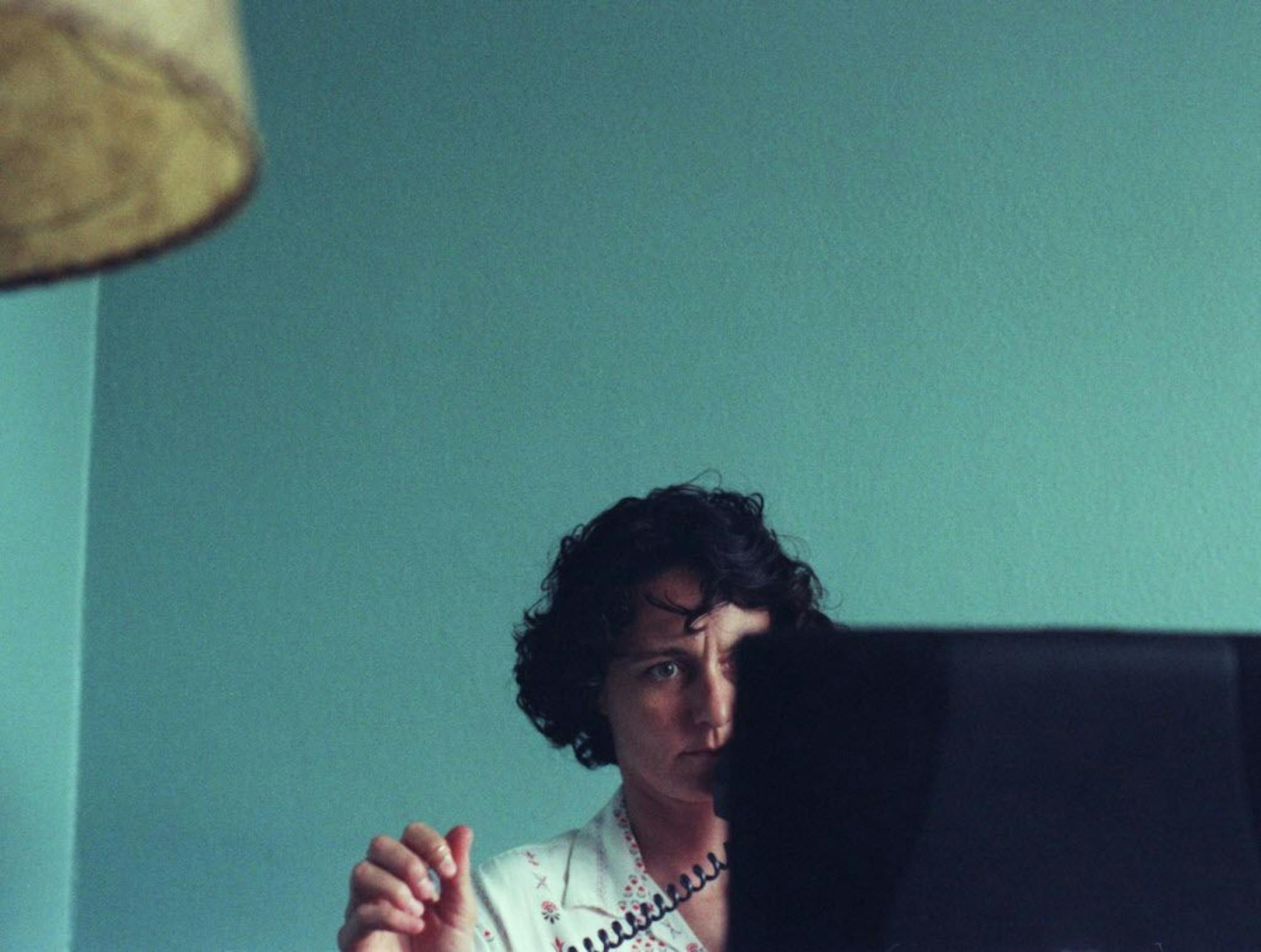 Minneapolis,MN;7/2/2002:Kim Bartmann deals with the business side of running the Bryant Lake Bowl, the Suburban World Theater, and Barbette from her office above Barbette.
