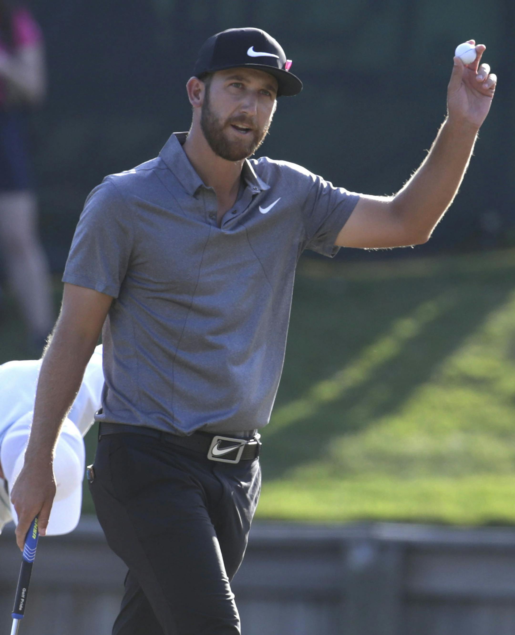 Kevin Chappell shows his ball after making par on the 18th hole during the final round of The Players Championship golf tournament Sunday, May 15, 2016, in Ponte Vedra Beach, Fla. (AP Photo/Lynne Sladky)