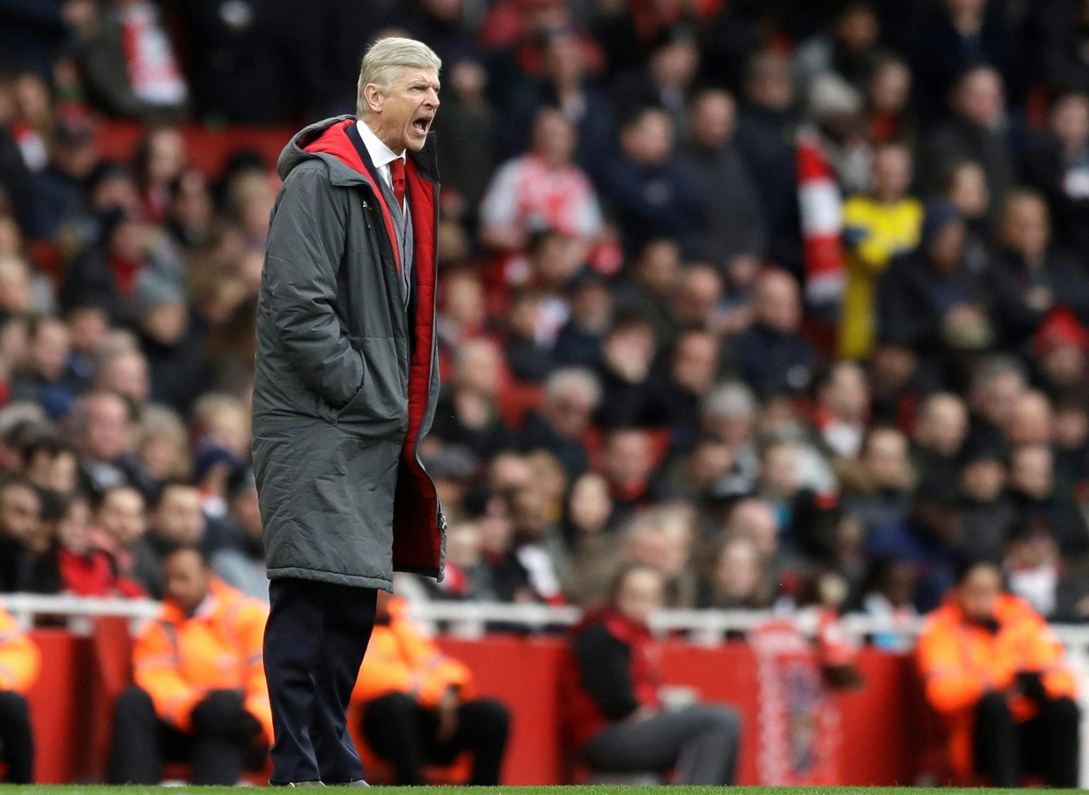 Arsenal French manager Arsene Wenger yells during the English Premier League soccer match between Arsenal and Watford at the Emirates stadium in London, Sunday, March 11, 2018. (AP Photo/Matt Dunham) ORG XMIT: XDB118