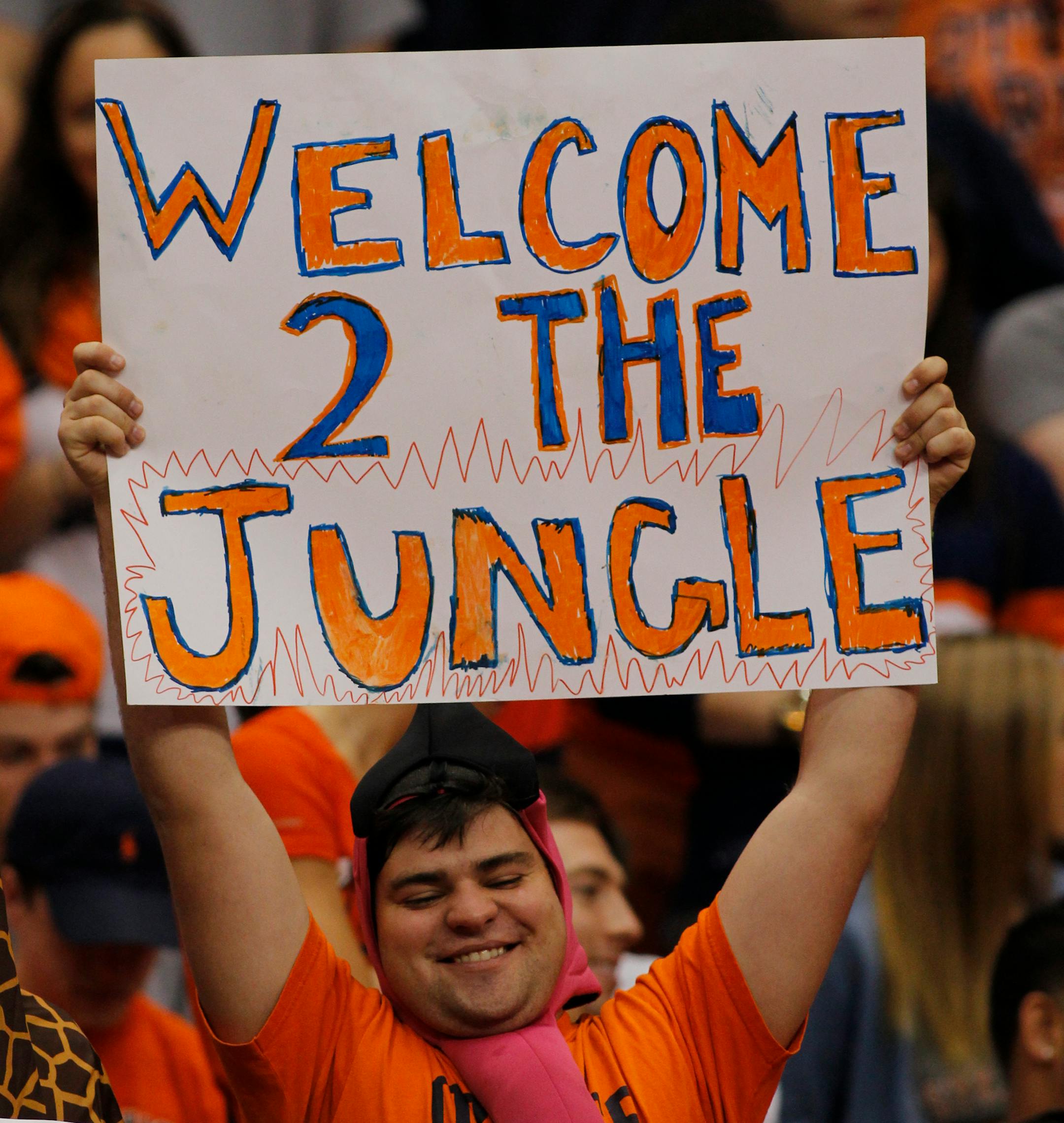Syracuse University student Joe Plummer of Gettysburg, PA, holds a sign in the first half of an NCAA college basketball game against North Carolina in the Carrier Dome in Syracuse, N.Y., Saturday, Jan. 11, 2014. Syracuse won 57-45. (AP Photo/Nick Lisi)