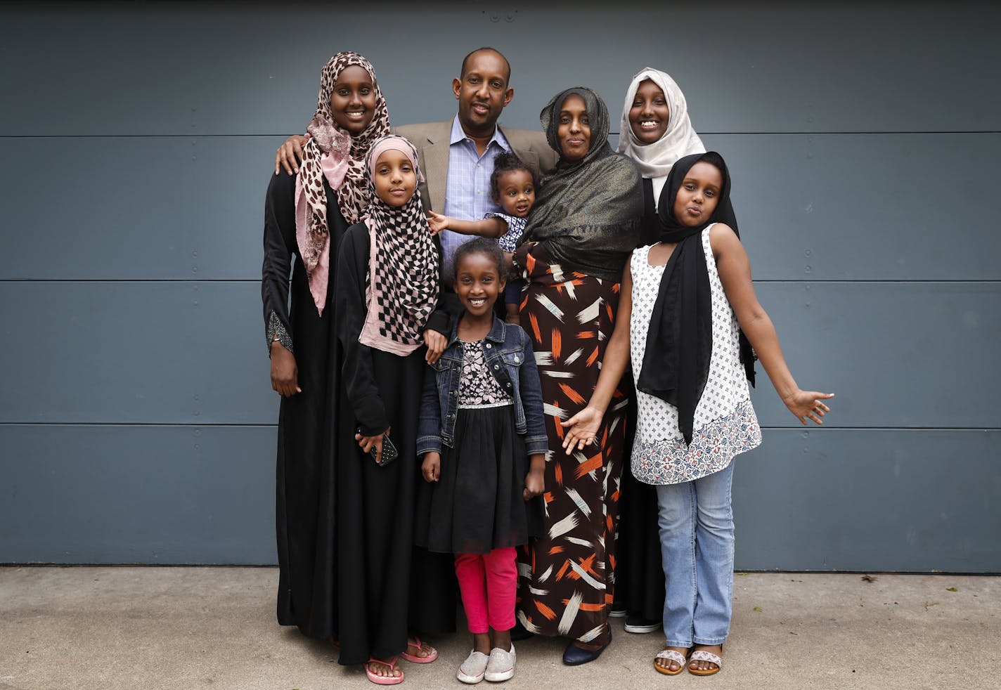 Ahmed Muhumud, center, and his wife and 6 daughters, from left, Ashwaq Abdirahman, 13, Amira Abdirahman, 11, Salma Abdirahman, 7, Azhar Abdirahman, 14 months, Halimo Haji, mother, Asmaa Abdirahman, 14, and Asra Abdirahman, 8, photographed on Friday, May 12, 2016, in Bloomington.