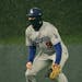 Los Angeles Dodgers second baseman Gavin Lux (9) waited for the hitter in the pouring rain.