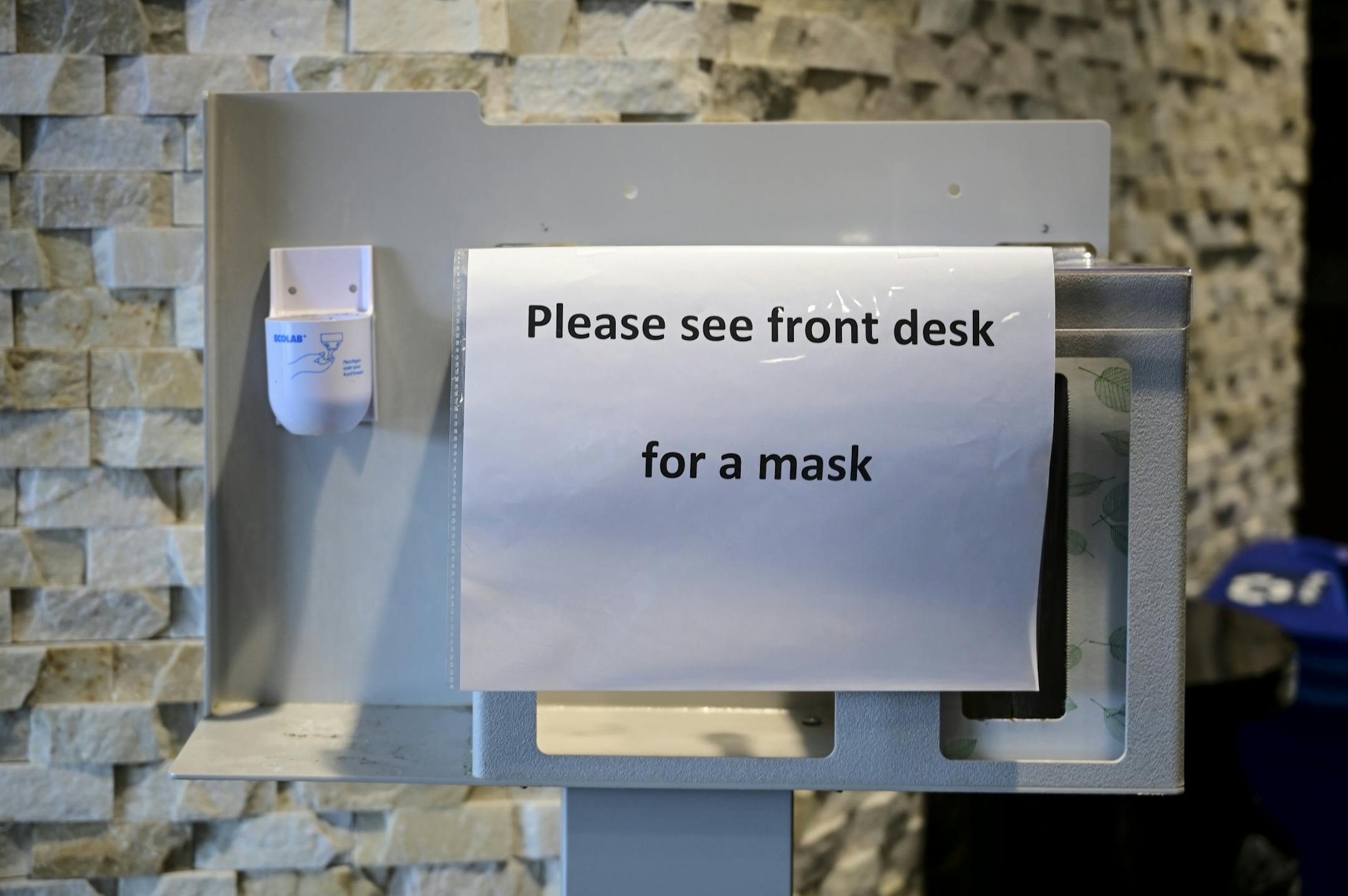 Masks and hand sanitizer, which are typically located at the entrance of M Health Fairview Clinic in Fridley, were relocated to the front desk.