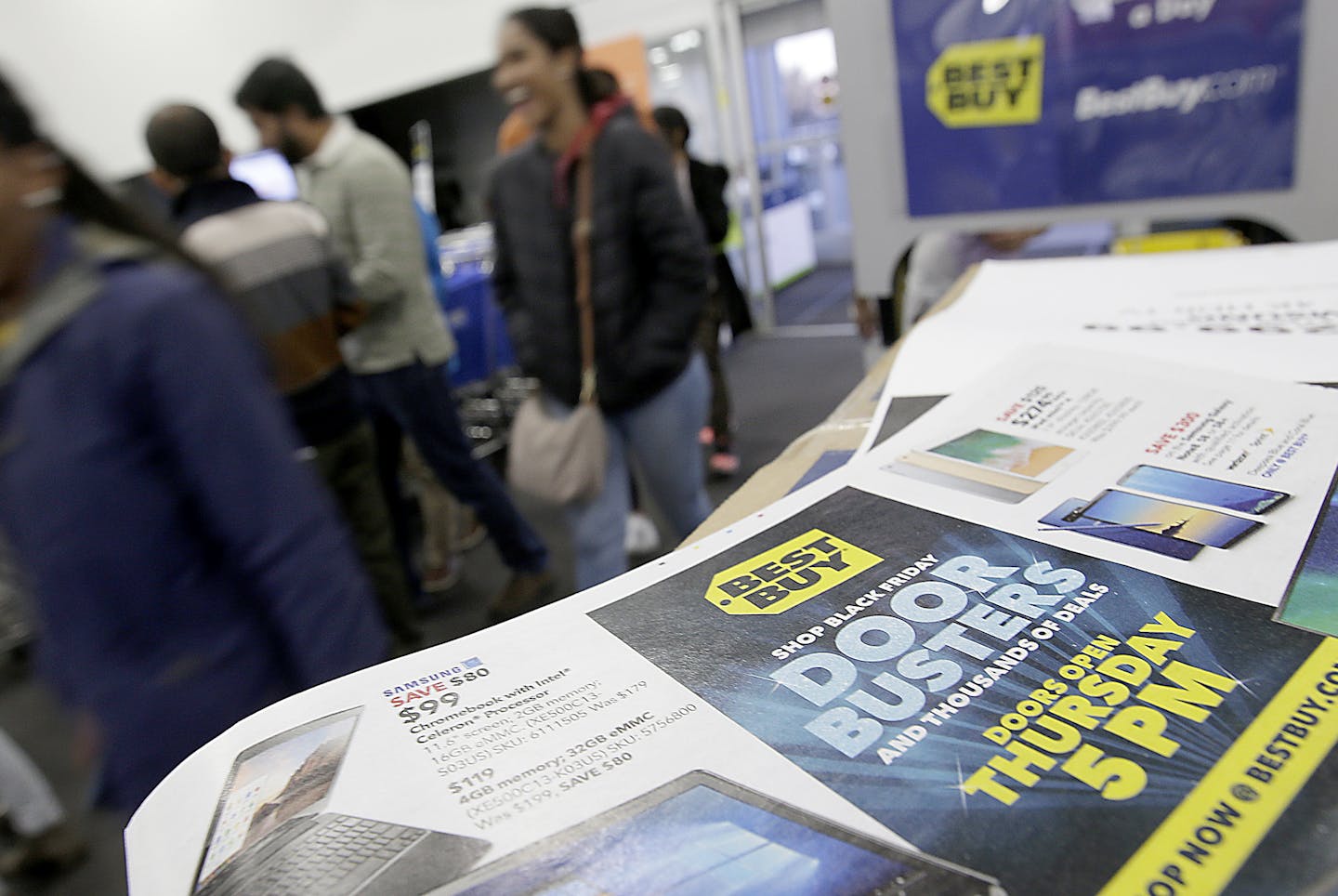 People enter a Best Buy store as it opened for a Black Friday sale on Thanksgiving Day, Thursday, Nov. 23, 2017, in Overland Park, Kan. Shoppers are hitting the stores on Thanksgiving as retailers under pressure look for ways to poach shoppers from their rivals. (AP Photo/Charlie Riedel)