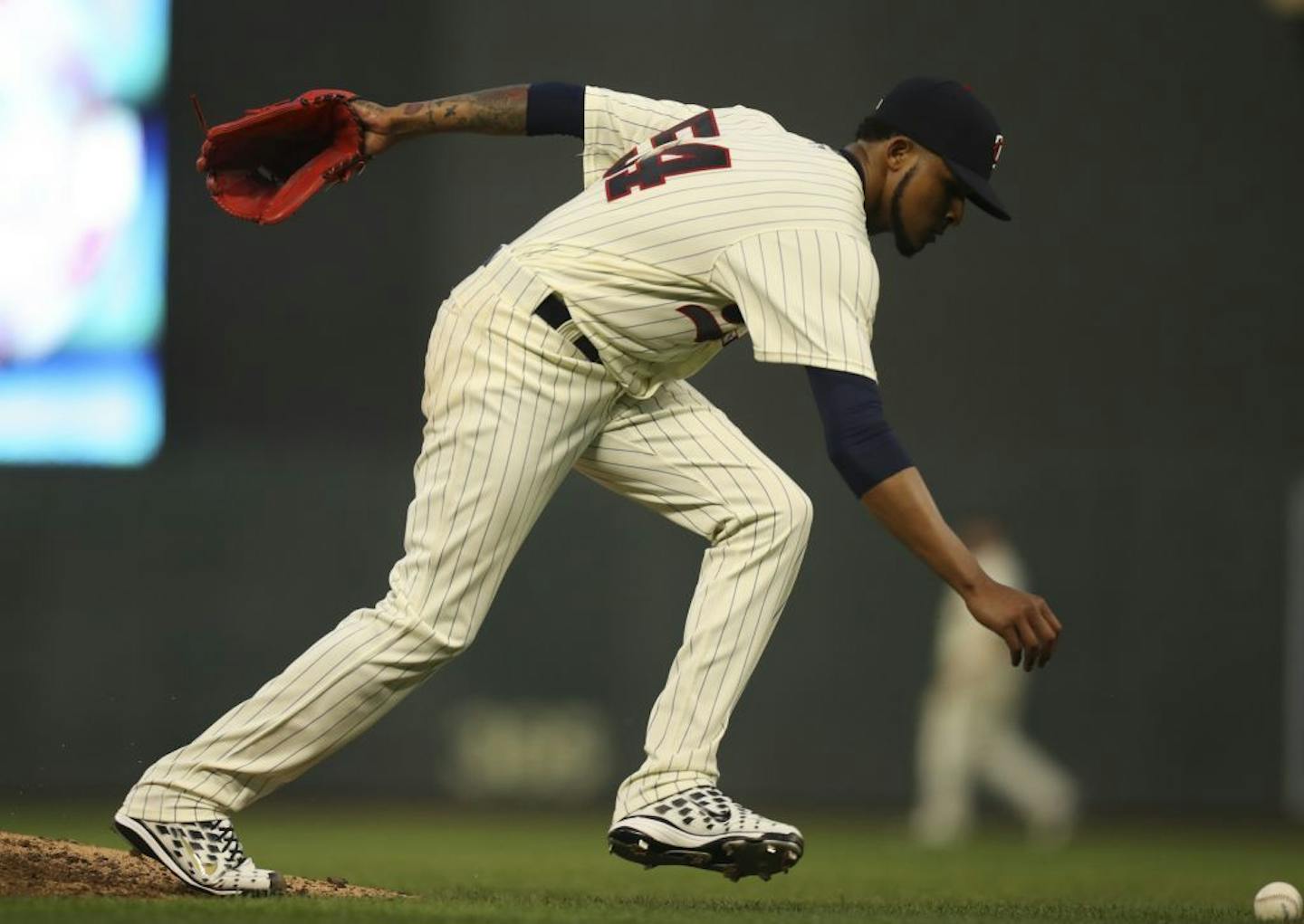 Minnesota Twins starting pitcher Ervin Santana reached for the ball after knocking down a line drive by Los Angeles Angels first baseman Luis Valbuena in the seventh inning. He made the throw to first for the out.