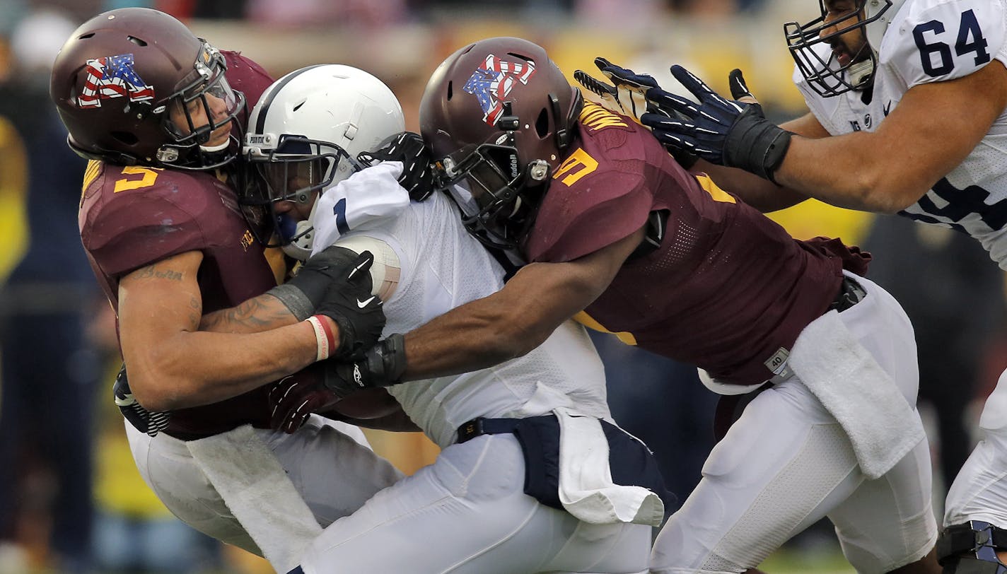 Minnesota Gophers vs. Penn State. Minnesota won 24-10. Minnesota defenders Damien Wilson (5) and James Manuel (9) threw Penn State running back Bill Belton (1) for a loss in 2nd half action. (MARLIN LEVISON/STARTRIBUNE(mlevison@startribune.com)