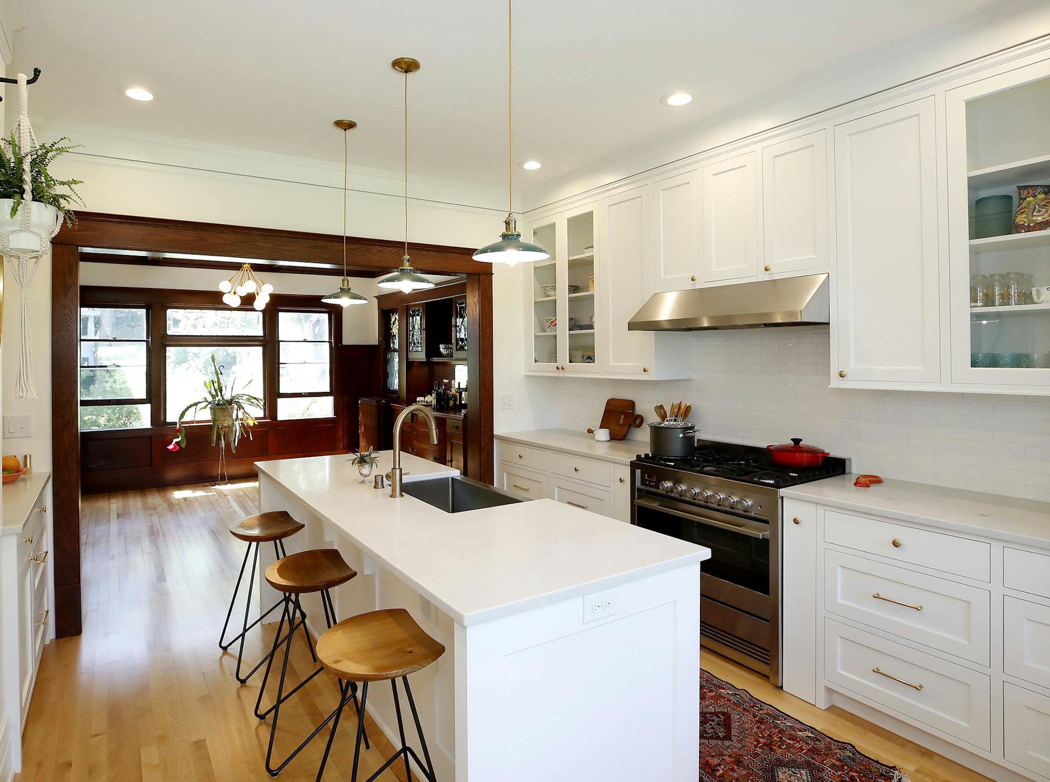 The light-filled spaces in Maryam Sarreshteh's 1910 Arts & Crafts home include a contemporary fresh white kitchen. ] CARLOS GONZALEZ ï cgonzalez@startribune.com ñ June 13, 2018, Minneapolis, MN, Maryam Sarreshteh made her 1910 Arts and Crafts beauty livable for today - with the help of architect Eric Hansen.