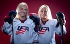 FILE - In this Oct. 2, 2013, file photo, United States Olympic Winter Games Hockey players Jocelyn Lamoureux, left, and Monique Lamoureux pose for a p