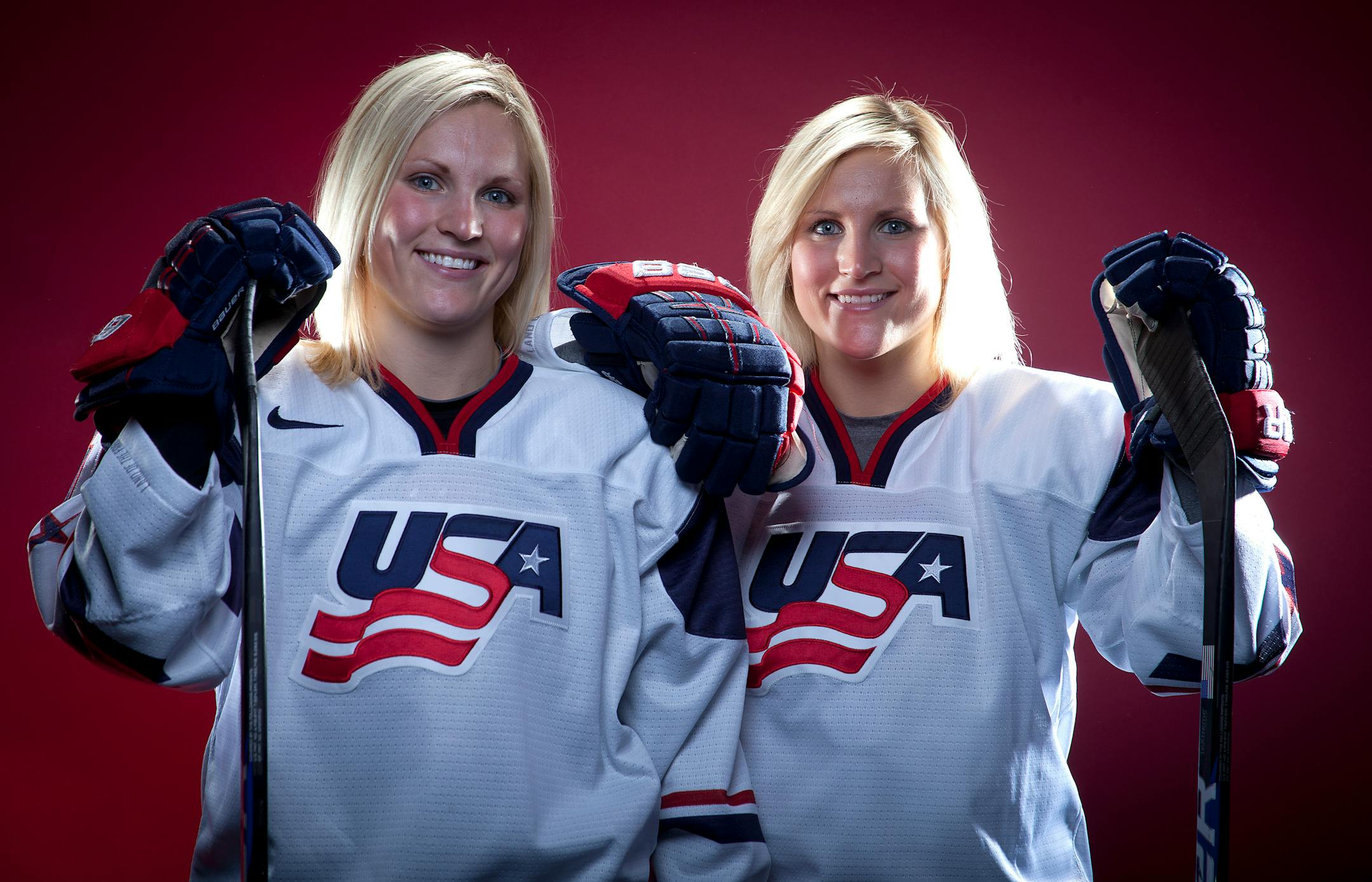 FILE - In this Oct. 2, 2013, file photo, United States Olympic Winter Games Hockey players Jocelyn Lamoureux, left, and Monique Lamoureux pose for a portrait at the Team USA Media Summit in Park City, Utah. Monique Lamoureux-Morando and twin sister Jocelyne Lamoureux-Davidson, members of the U.S. women's national hockey team, are so ready to start training for the 2018 Winter Olympics that not even driving from North Dakota to Tampa is daunting. (AP Photo/Carlo Allegri, File)