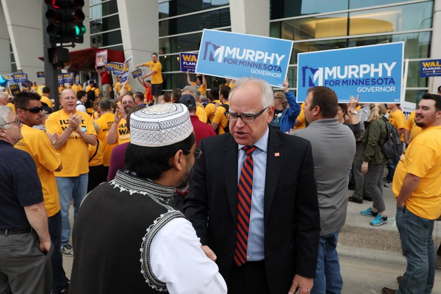 Gubernatorial candidate Tim Walz greeted a supporter during a rally Saturday morning.