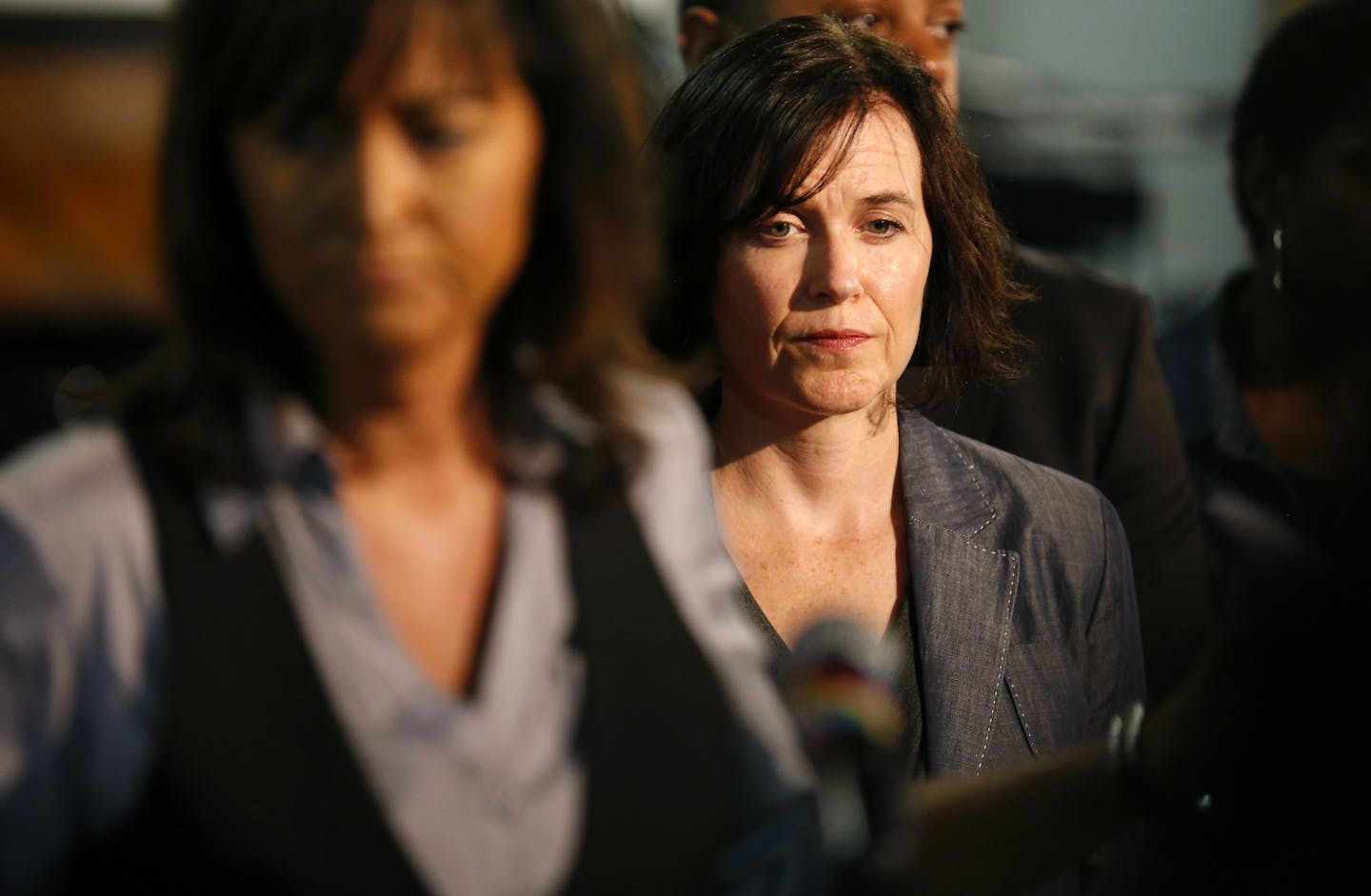 Minneapolis Mayor Betsy Hodges listened as Minneapolis Police Chief Janee Harteau finished addressing the media during a press conference at the Shiloh temple on Sunday afternoon.