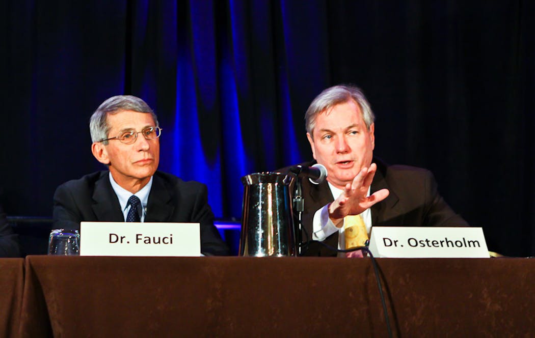 Dr. Anthony S. Fauci and Michael T. Osterholm in 2012 at the American Society for Microbiology Biodefense and Emerging Diseases research meeting.