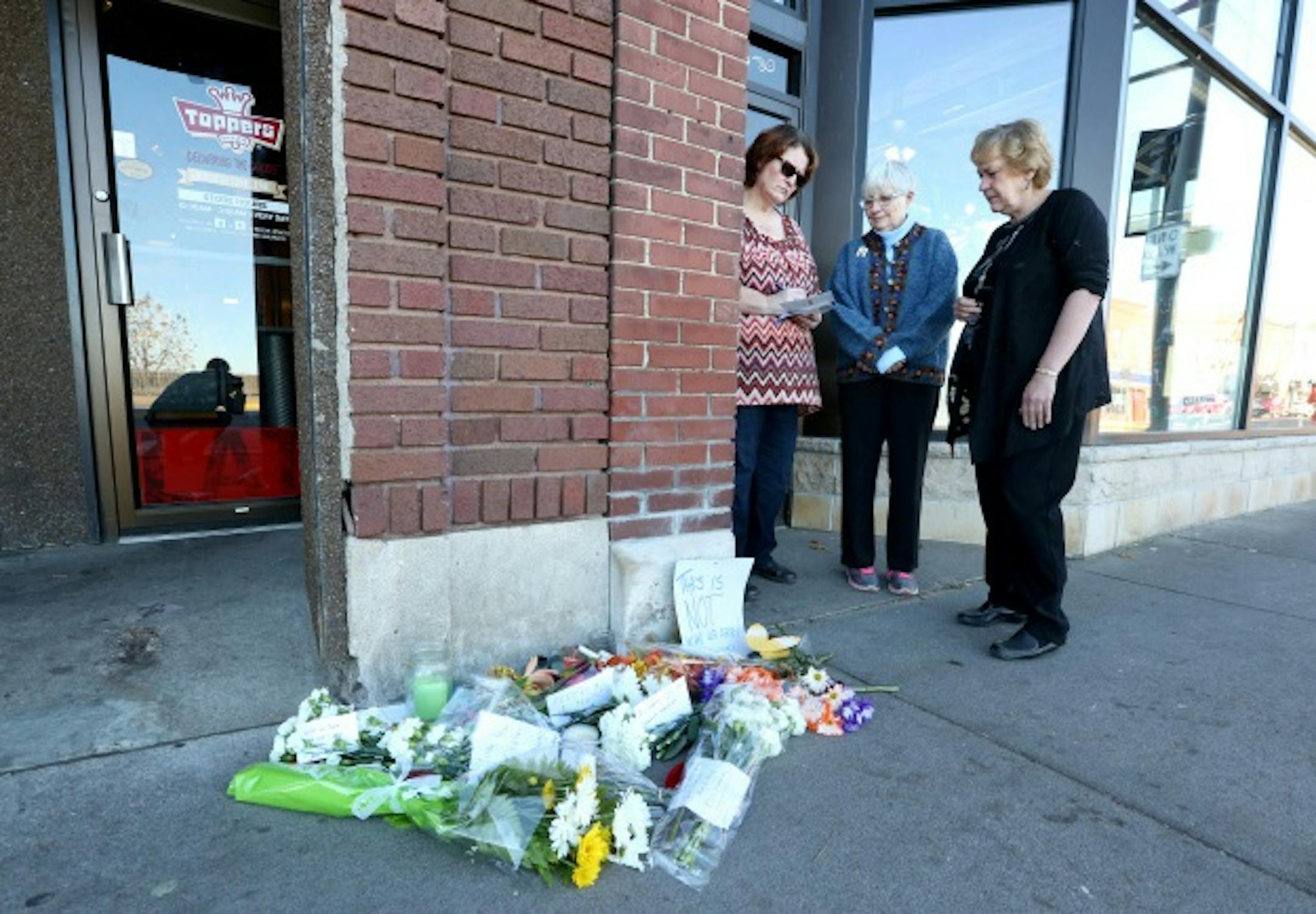 Flowers were left where University of Wisconsin, Stout, student Hussain Saeed Alnahdi was fatally attacked.