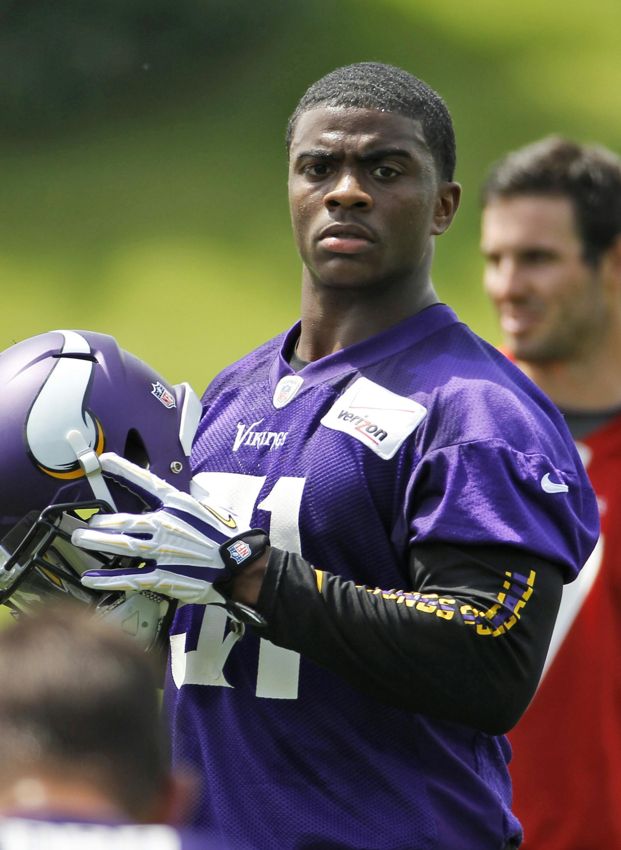 Minnesota Vikings Jerick McKinnon listens to a teammate during an NFL mini camp in Eden Prairie, Minn., Tuesday, June 17, 2014. The Vikings are hoping McKinnon's versatility and speed can provide a productive complement to Adrian Peterson in the backfield this season. (AP Photo/Ann Heisenfelt) ORG XMIT: MIN2014072318341396 ORG XMIT: MIN1407231837020782