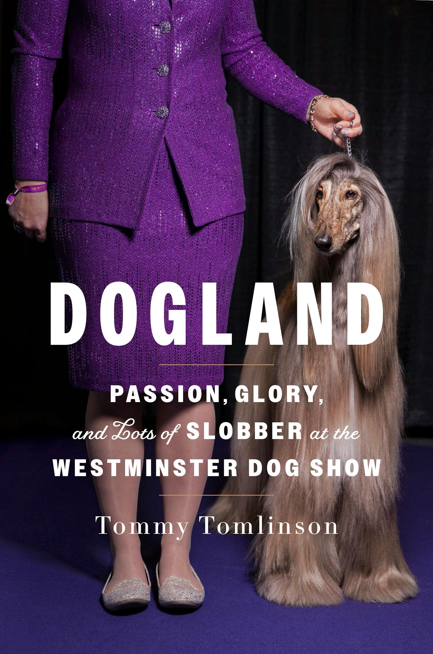 purple cover of "Dogland," photo depicting a dog on a dog trainer's leash.